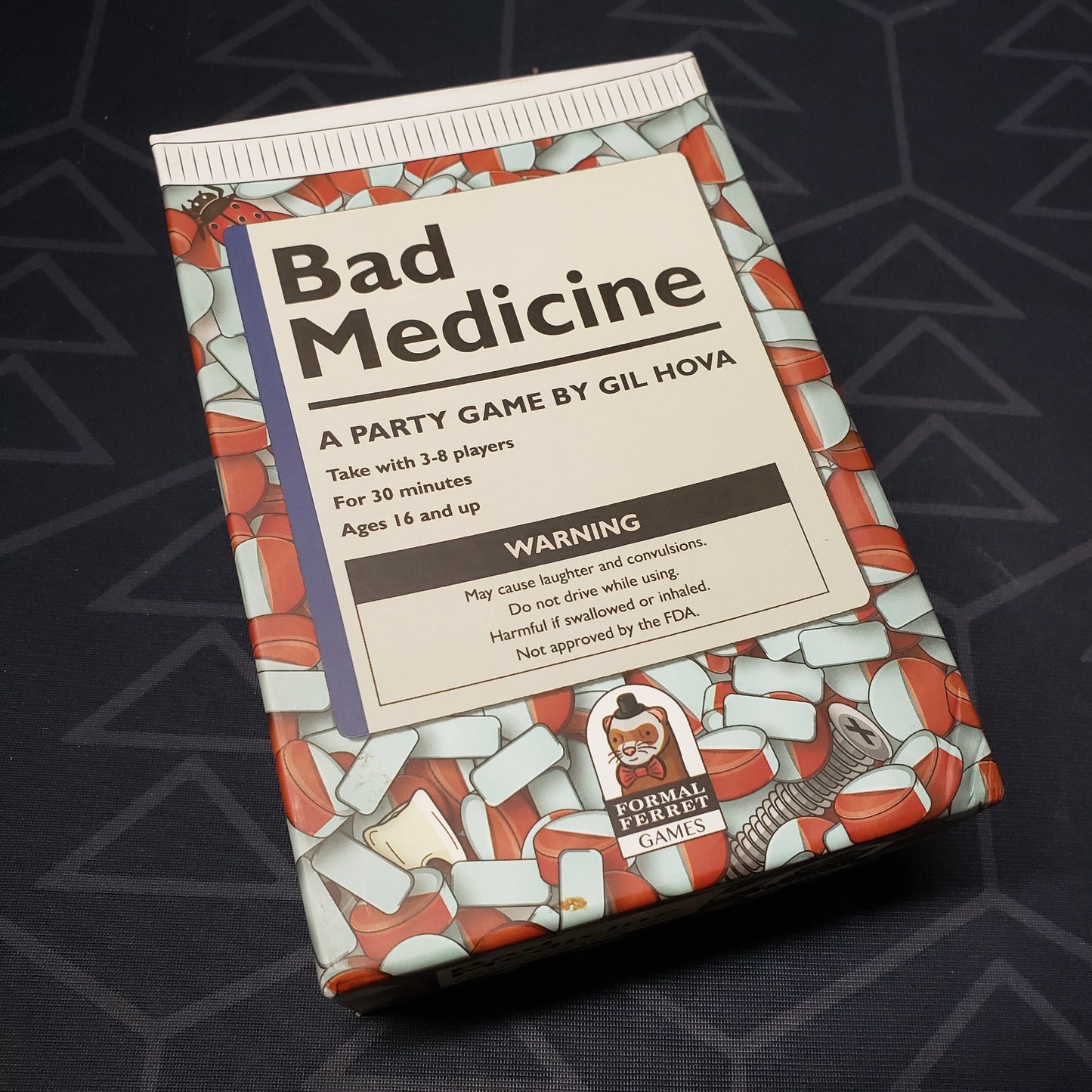 Image shows the front cover of the box for the Bad Medicine card game