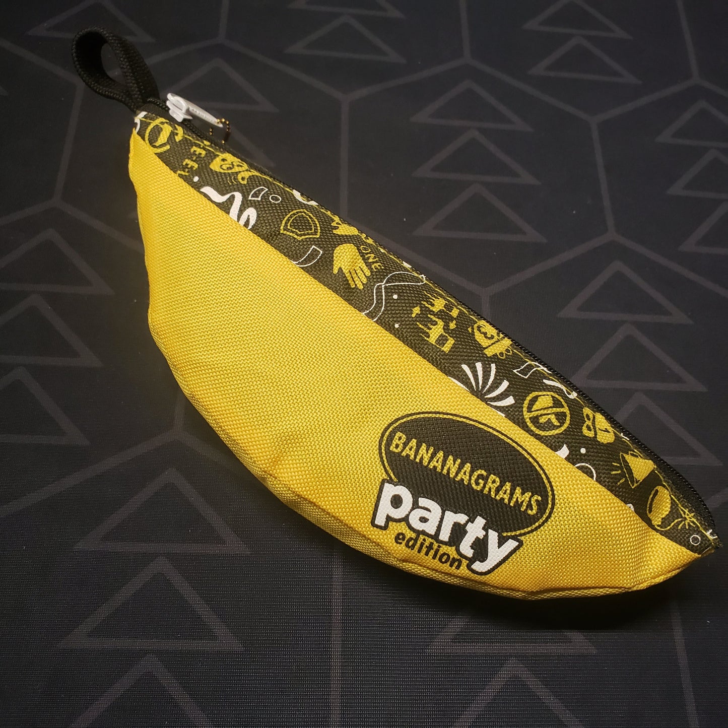 Image shows the banana-shaped pouch for the Bananagrams: Party Edition board game