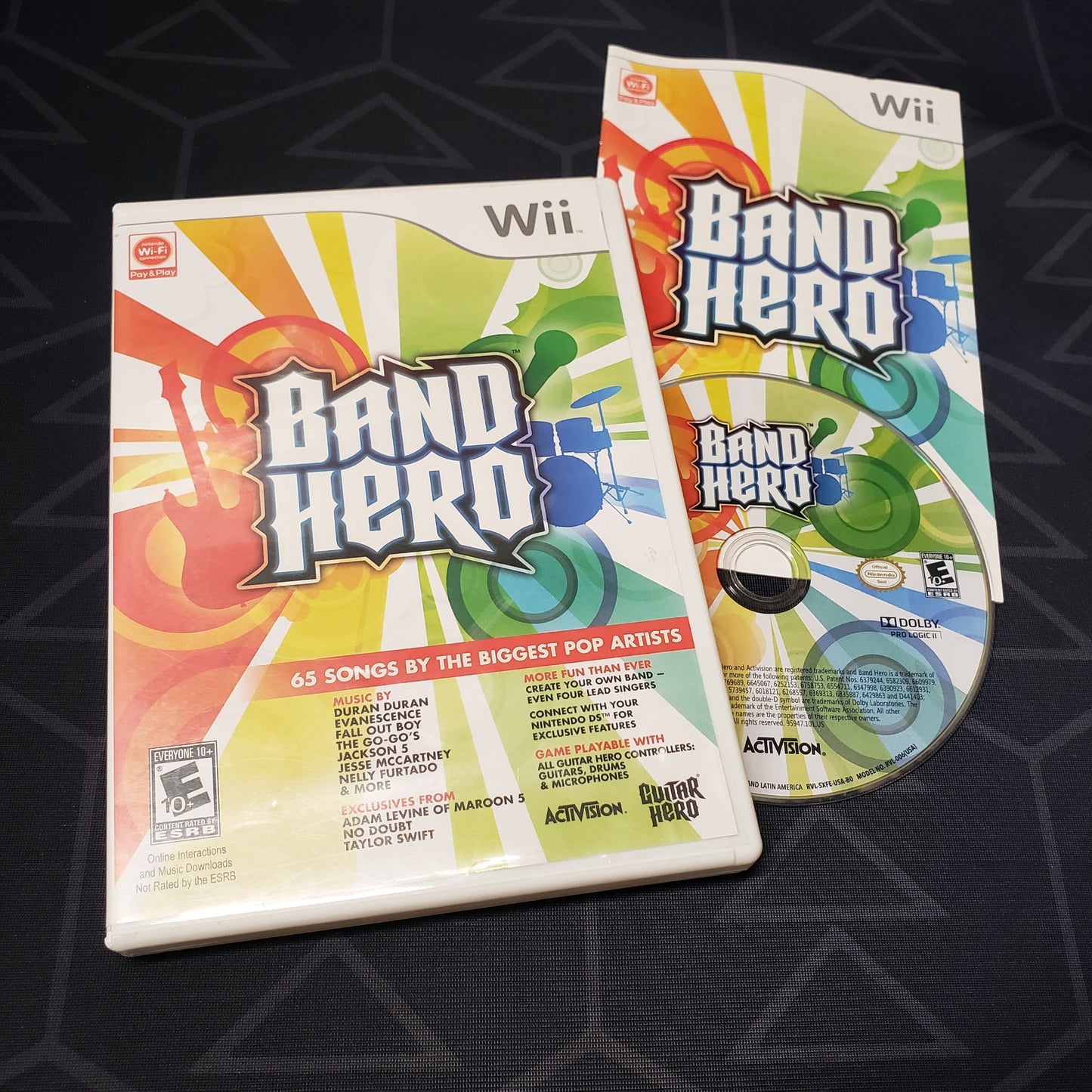 Image shows the case, manual and disc for the video game Band Hero for Nintendo Wii