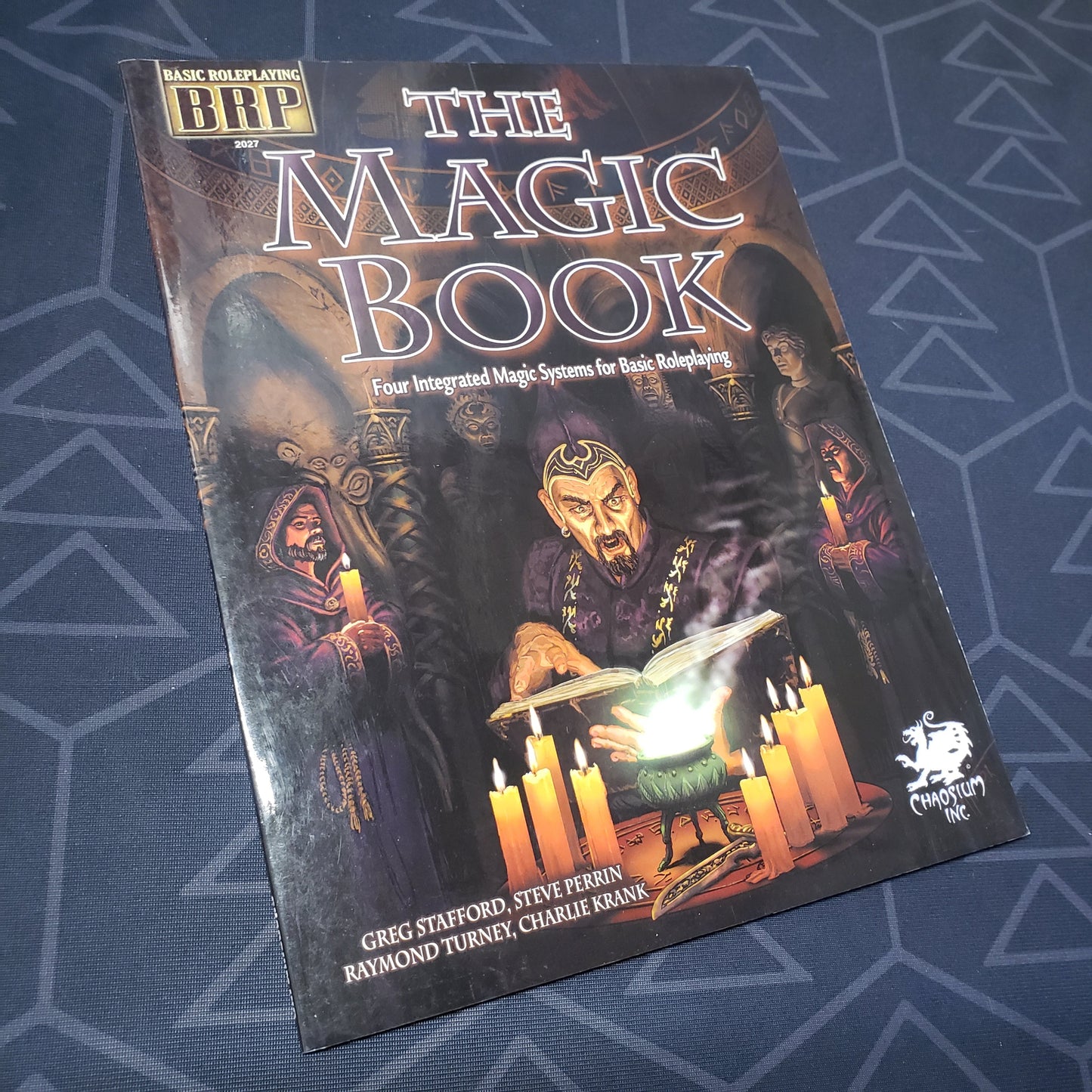 Image shows the front cover of the Magic Book for the roleplaying game Basic Roleplaying