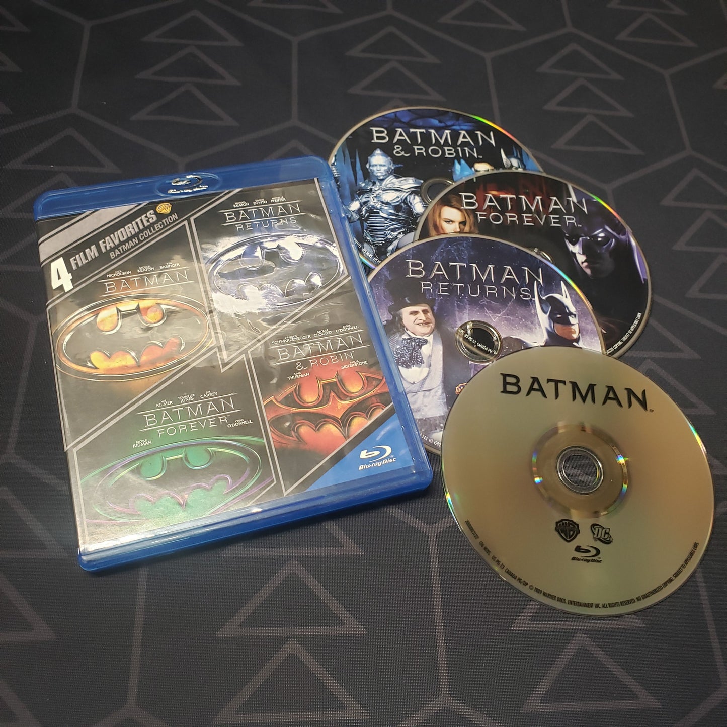 Image shows the case & four discs for the Batman: 4 Film Favorites movie set on Blu-Ray