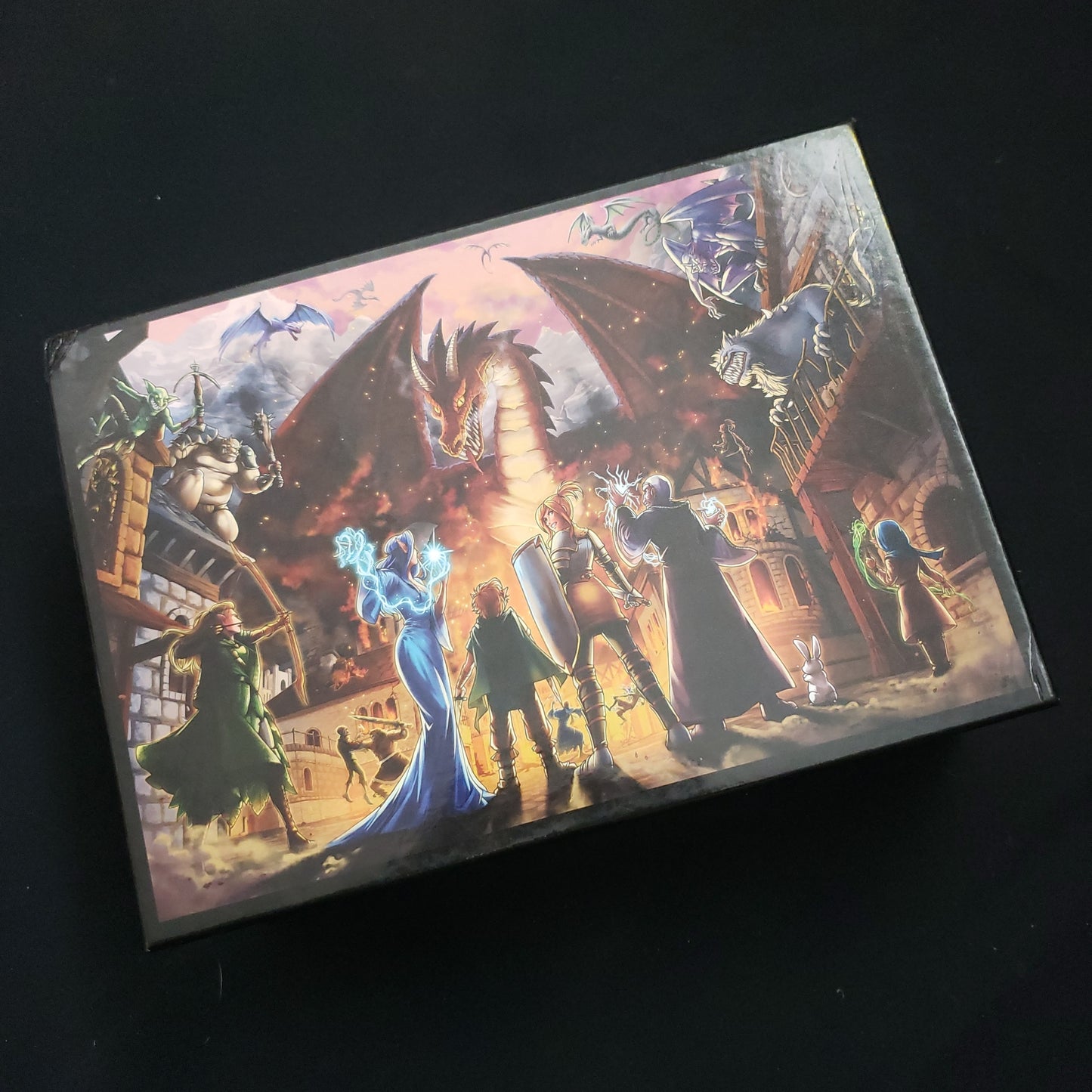 Image shows the front cover of the box of the Battle for Greyport card game