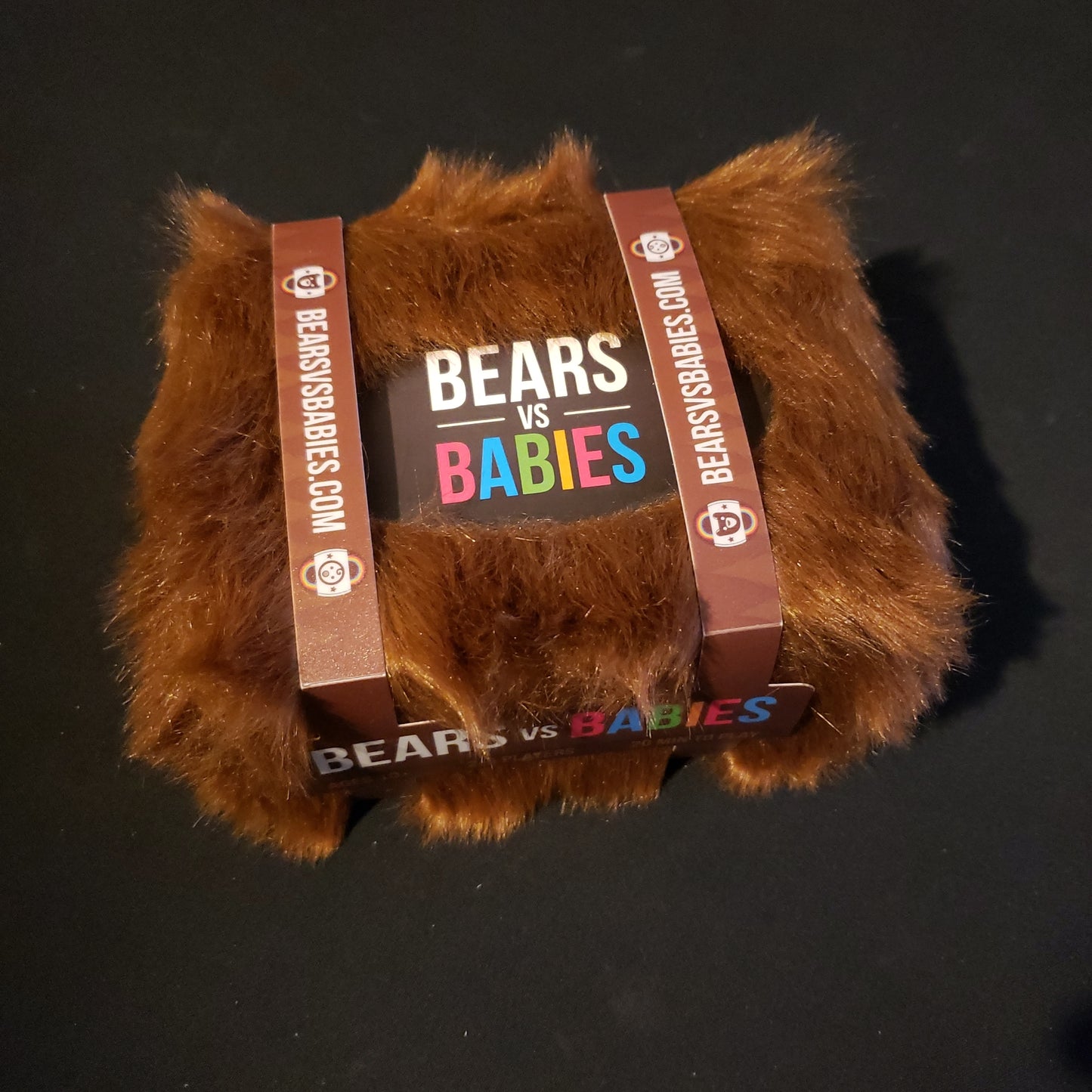 Image shows the front cover of the box of the Bears vs Babies card game