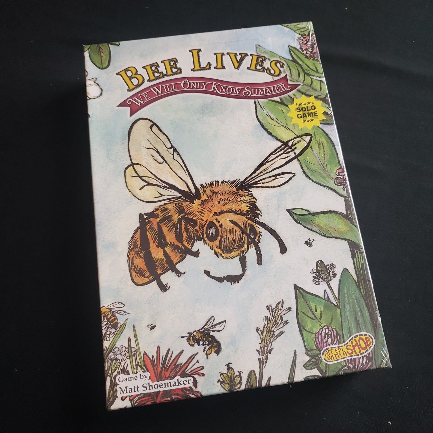 Image shows the front cover of the box of the Bee Lives: We Will Only Know Summer board game