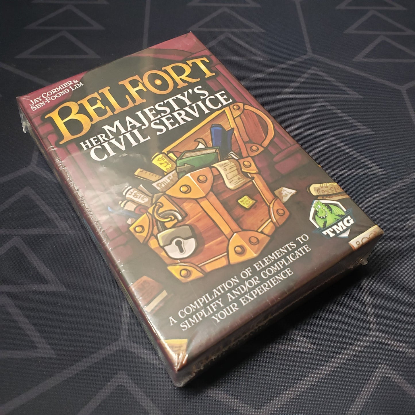 Image shows the front cover of the box of the Her Majesty's Civil Service expansion for the board game Belfort