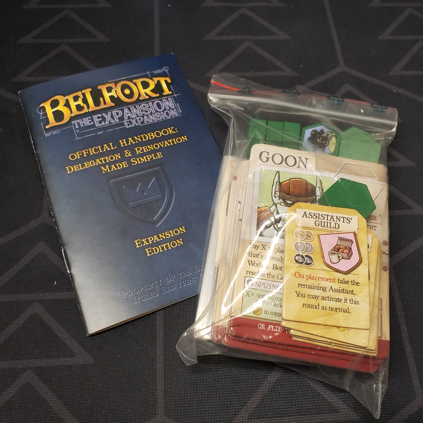 Image shows the instructions & bagged components the Expansion expansion for the board game Belfort