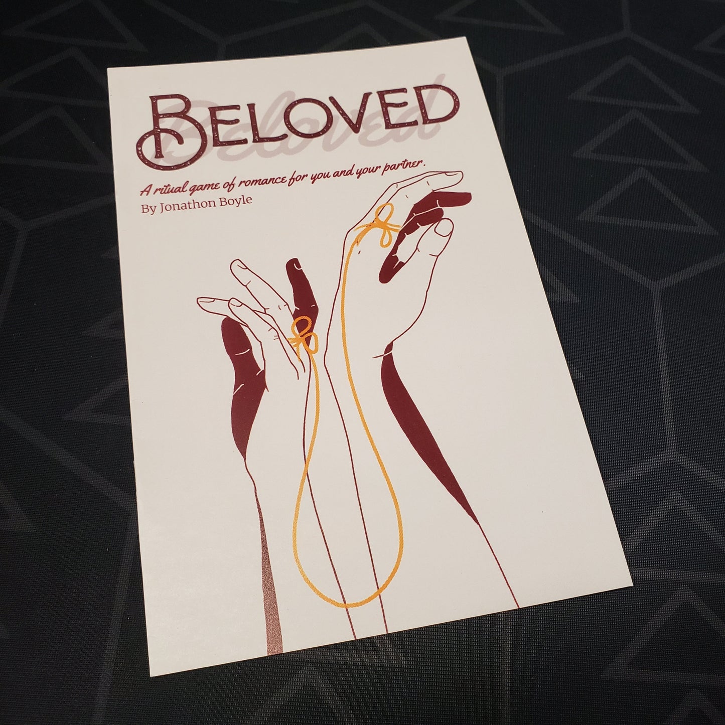 Image shows the front cover of the Beloved roleplaying game book