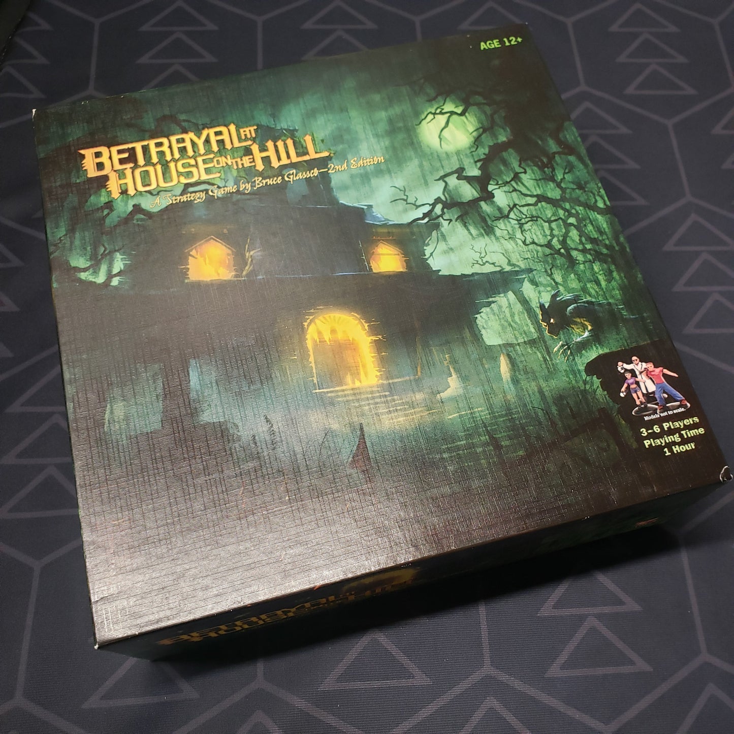 Image shows the front cover of the box of the Betrayal at House on the Hill board game