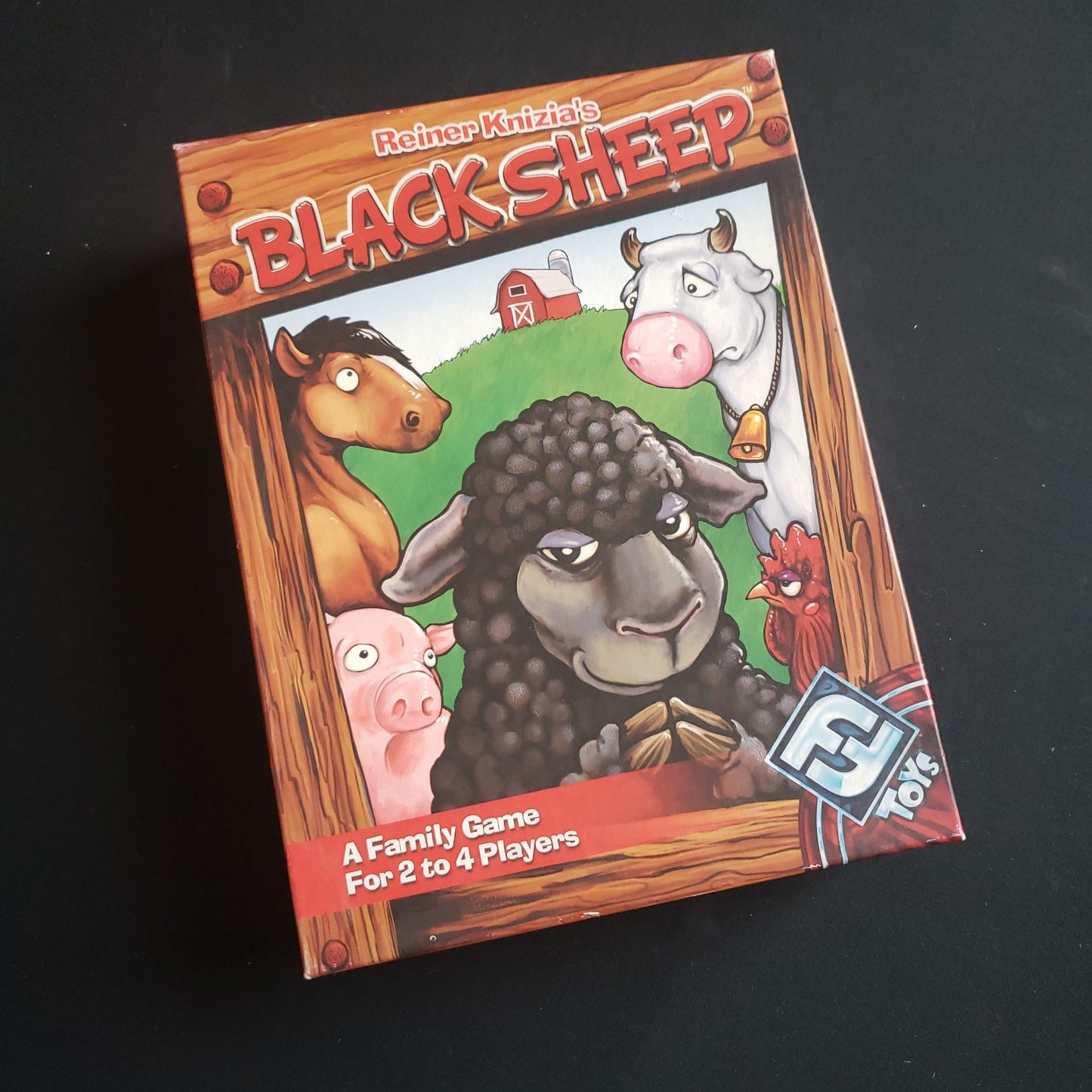 Image shows the front cover of the box of the Black Sheep board game