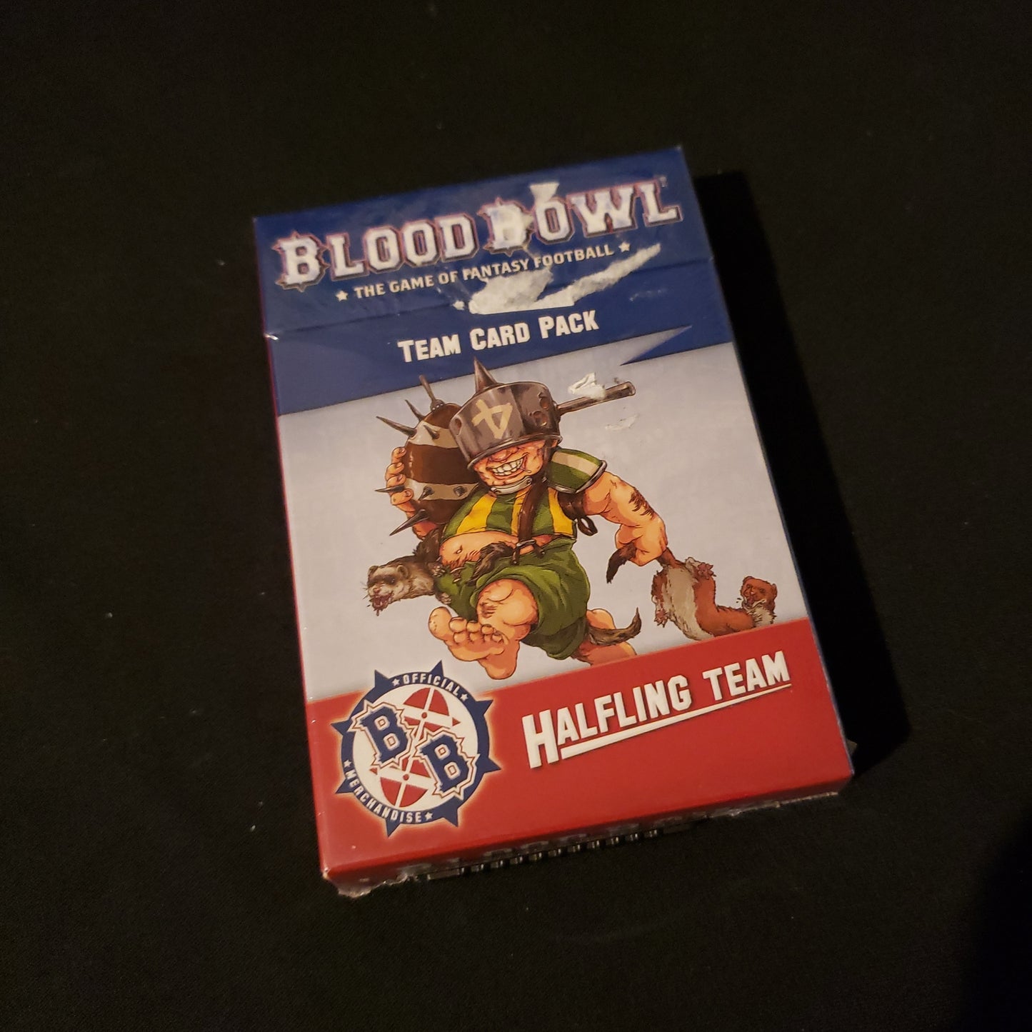 Image shows the front of the box for the Halfling Team Card Pack for the Blood Bowl miniatures game