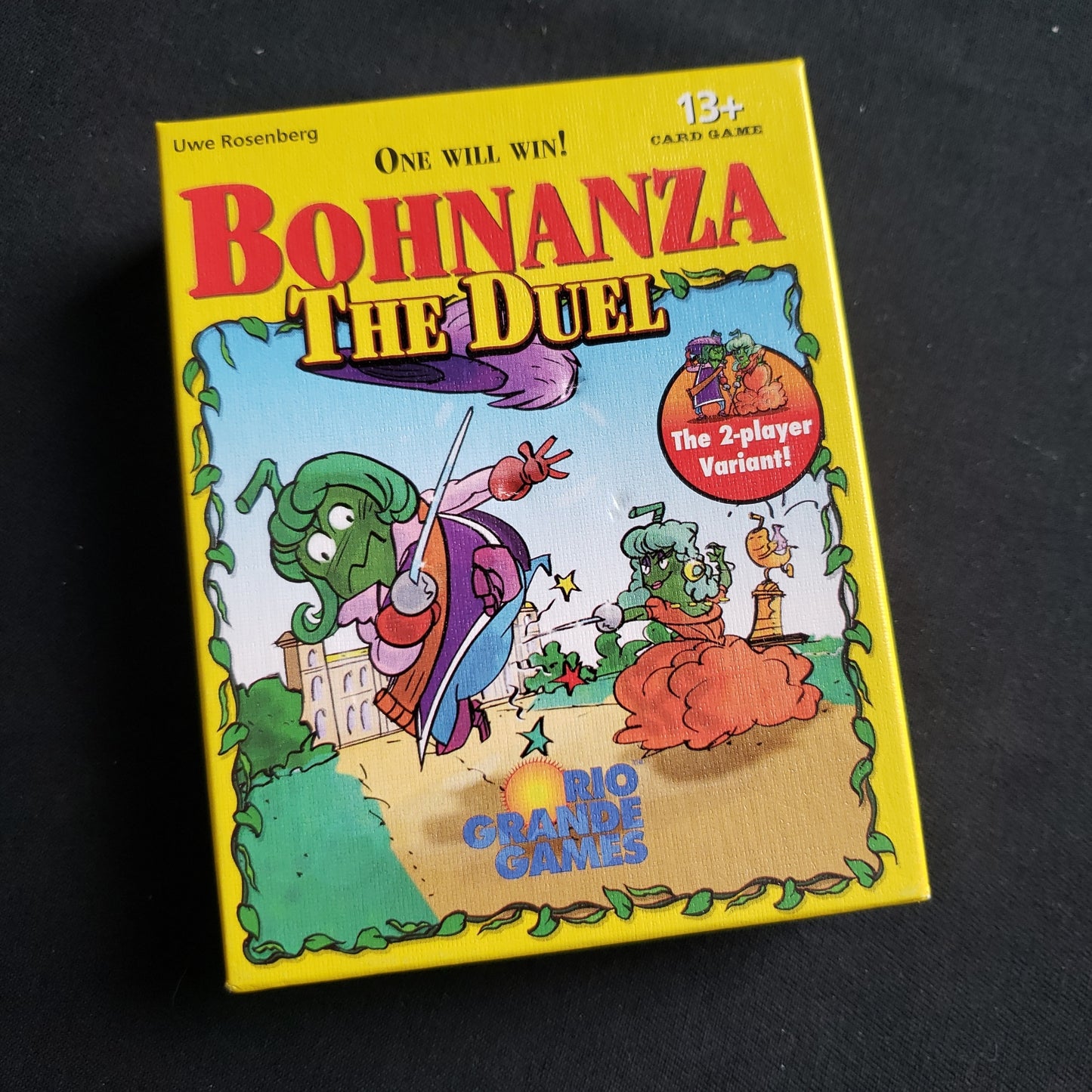 Image shows the front cover of the box of the Bohnzanza: The Duel card game