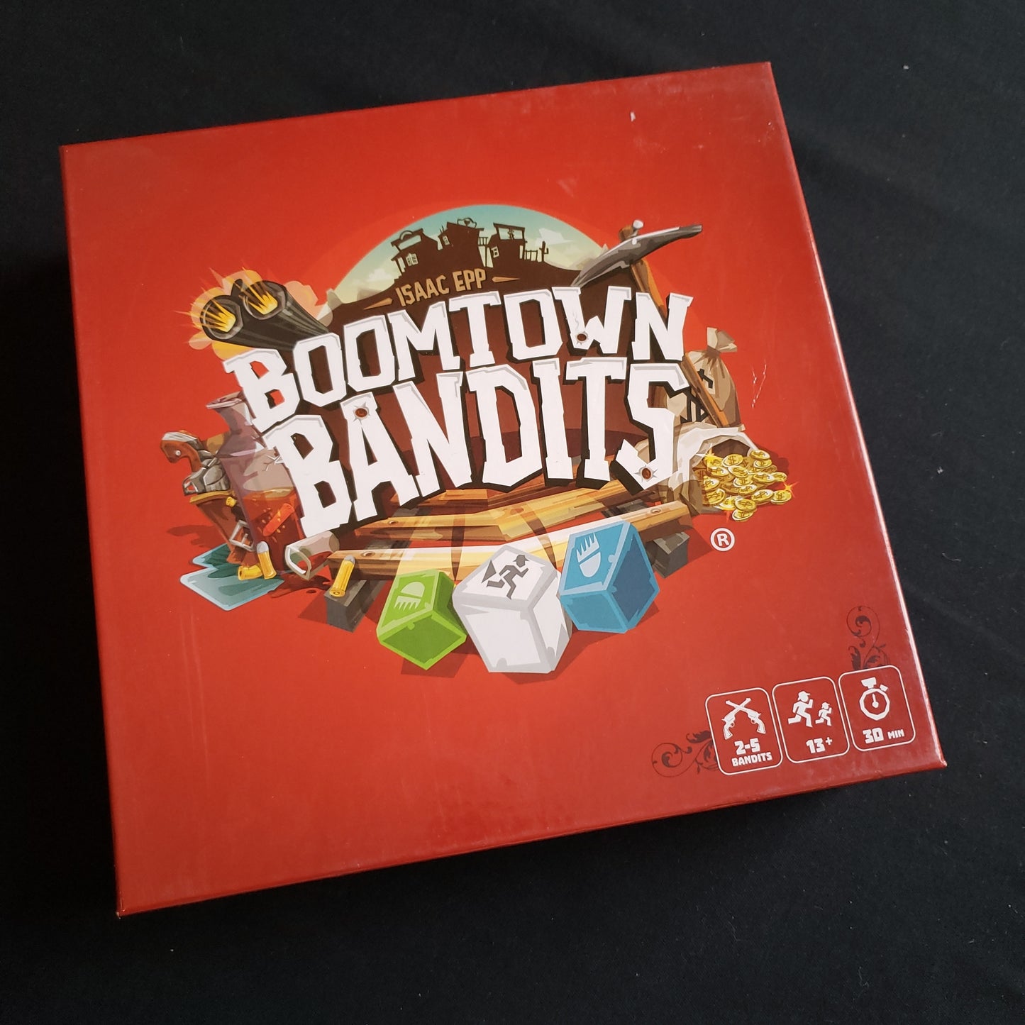 Image shows the front cover of the box of the Boomtown Bandits board game