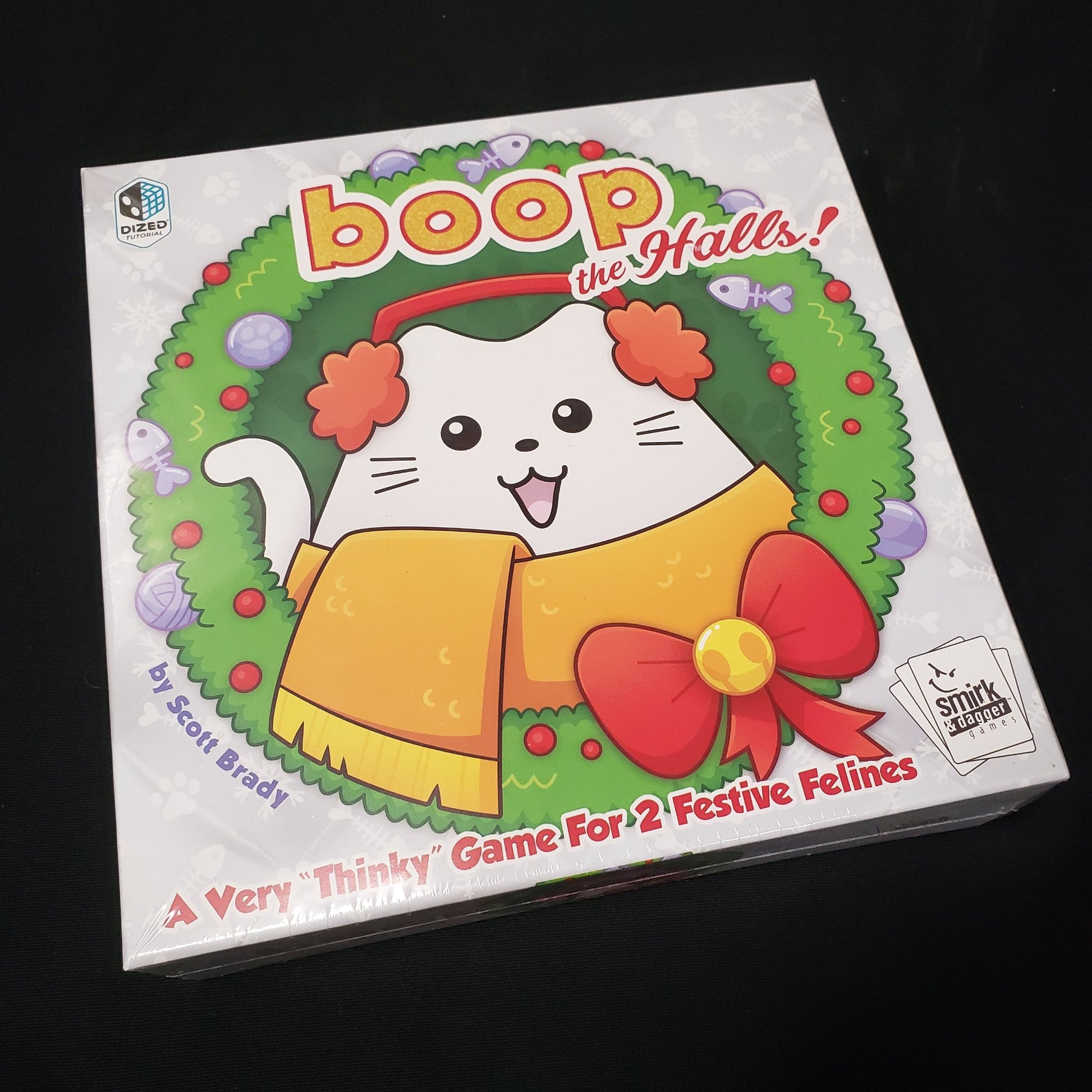 Image shows the front cover of the box of the board game Boop the Halls