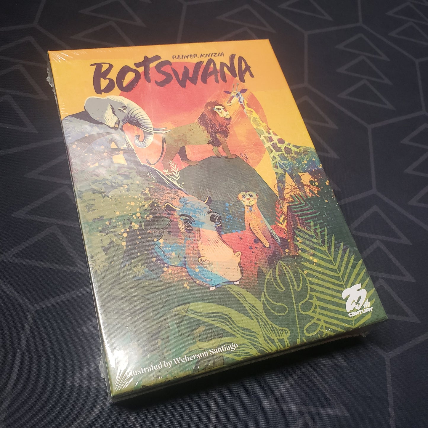 Image shows the front cover of the box of the Botswana card game