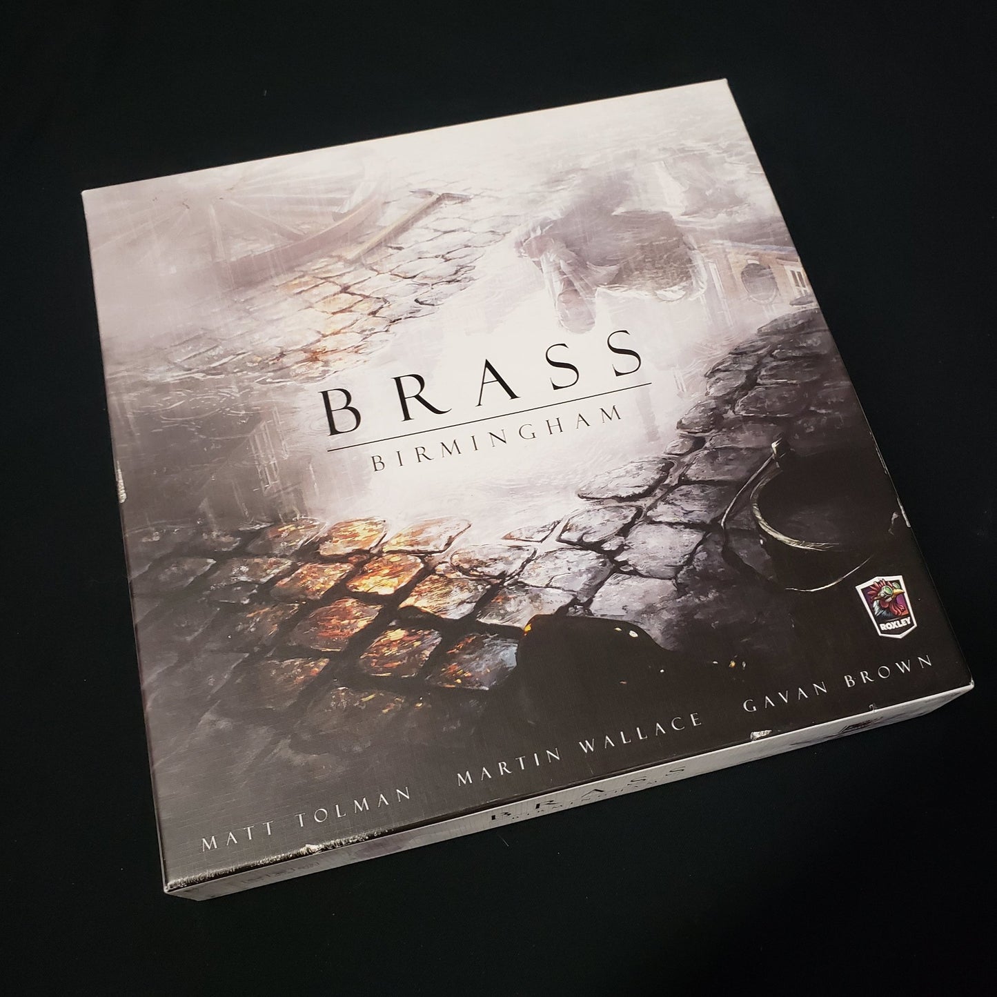 Image shows the front cover of the box of the Brass: Birmingham board game
