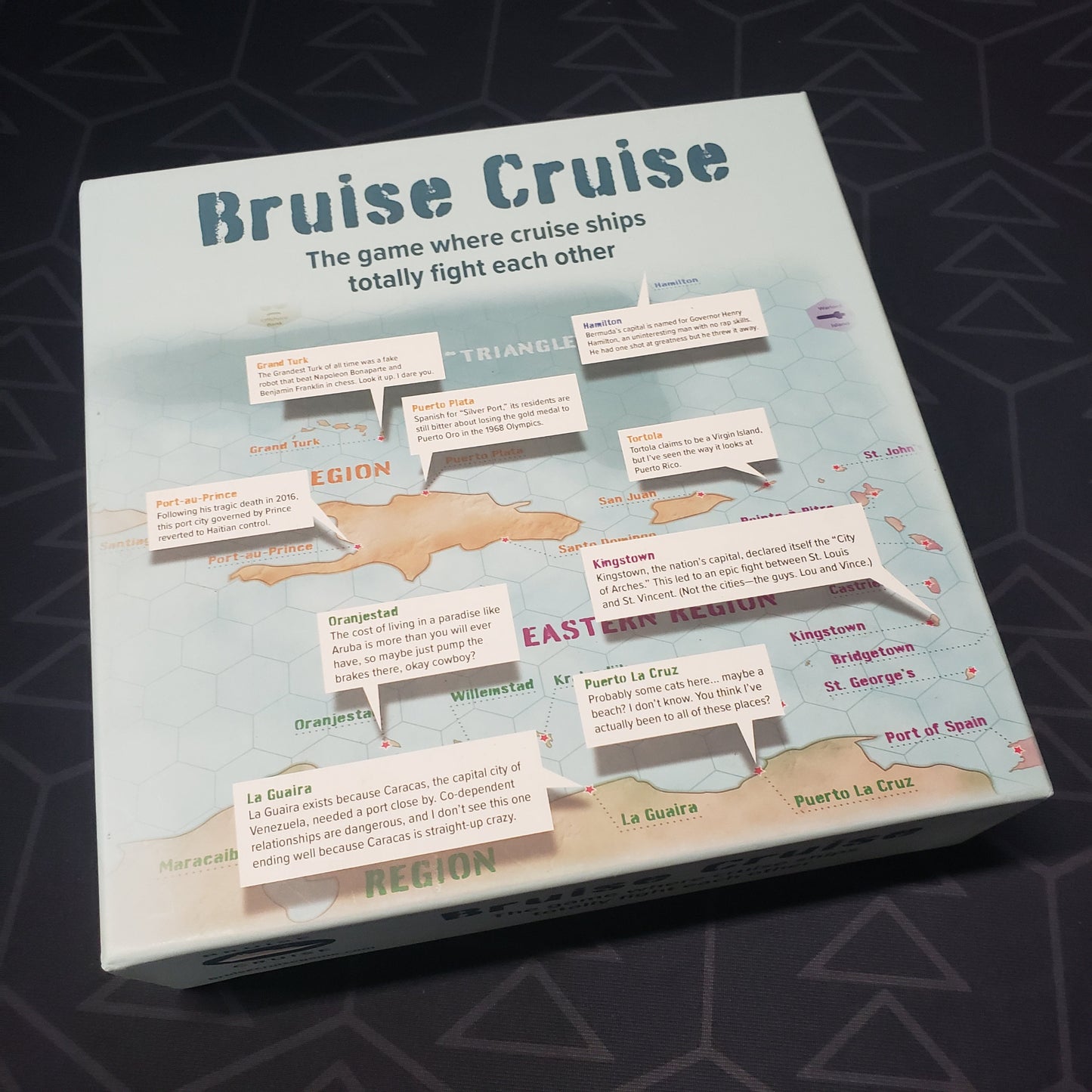 Image shows the front cover of the box for the Bruise Cruise board game