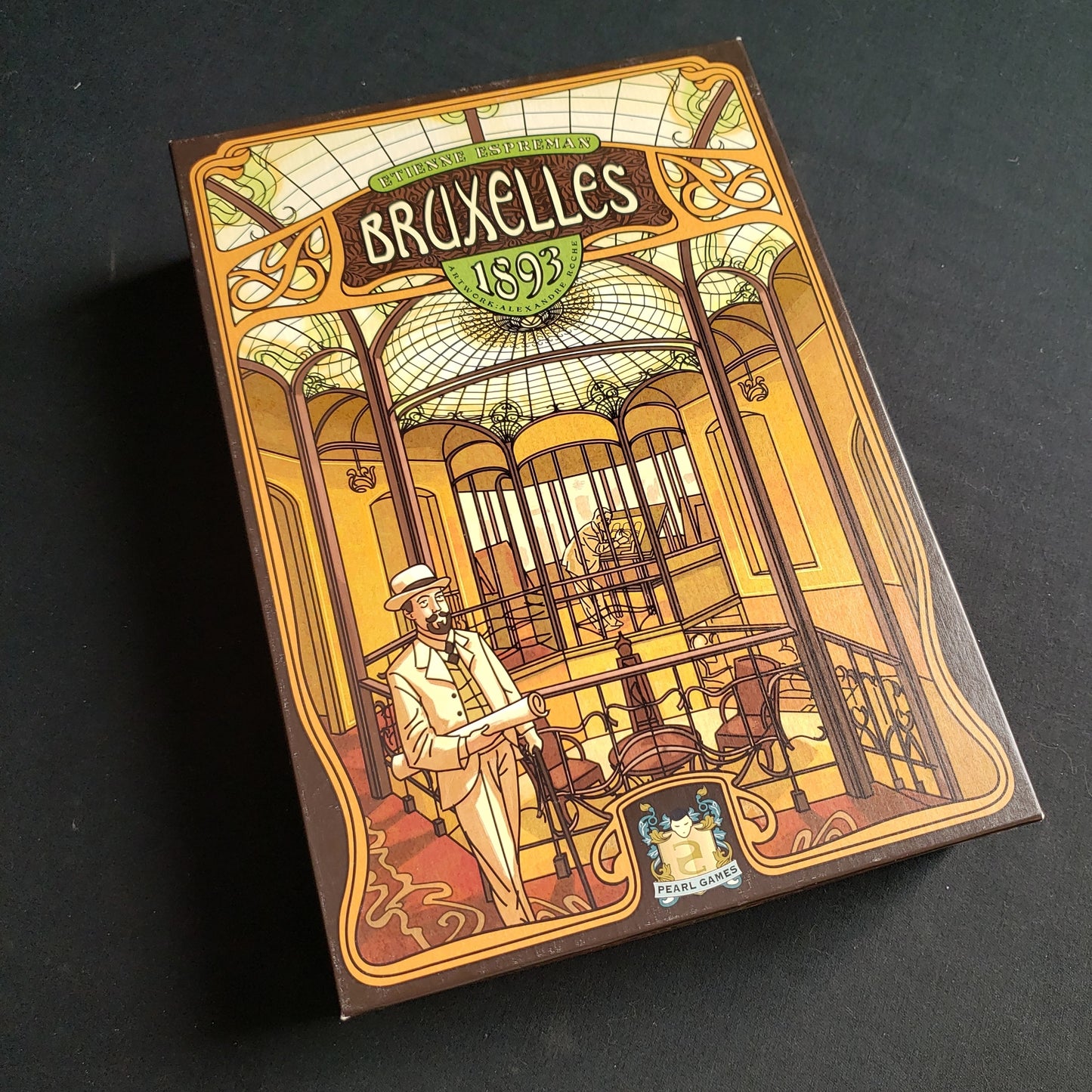 Image shows the front cover of the box of the Bruxelles 1893 board game