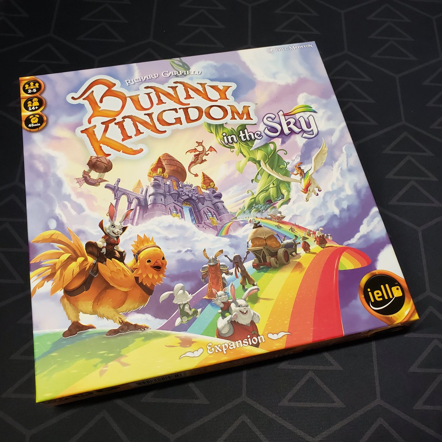 Image shows the front cover of the box of the In the Sky expansion for the board game Bunny Kingdom