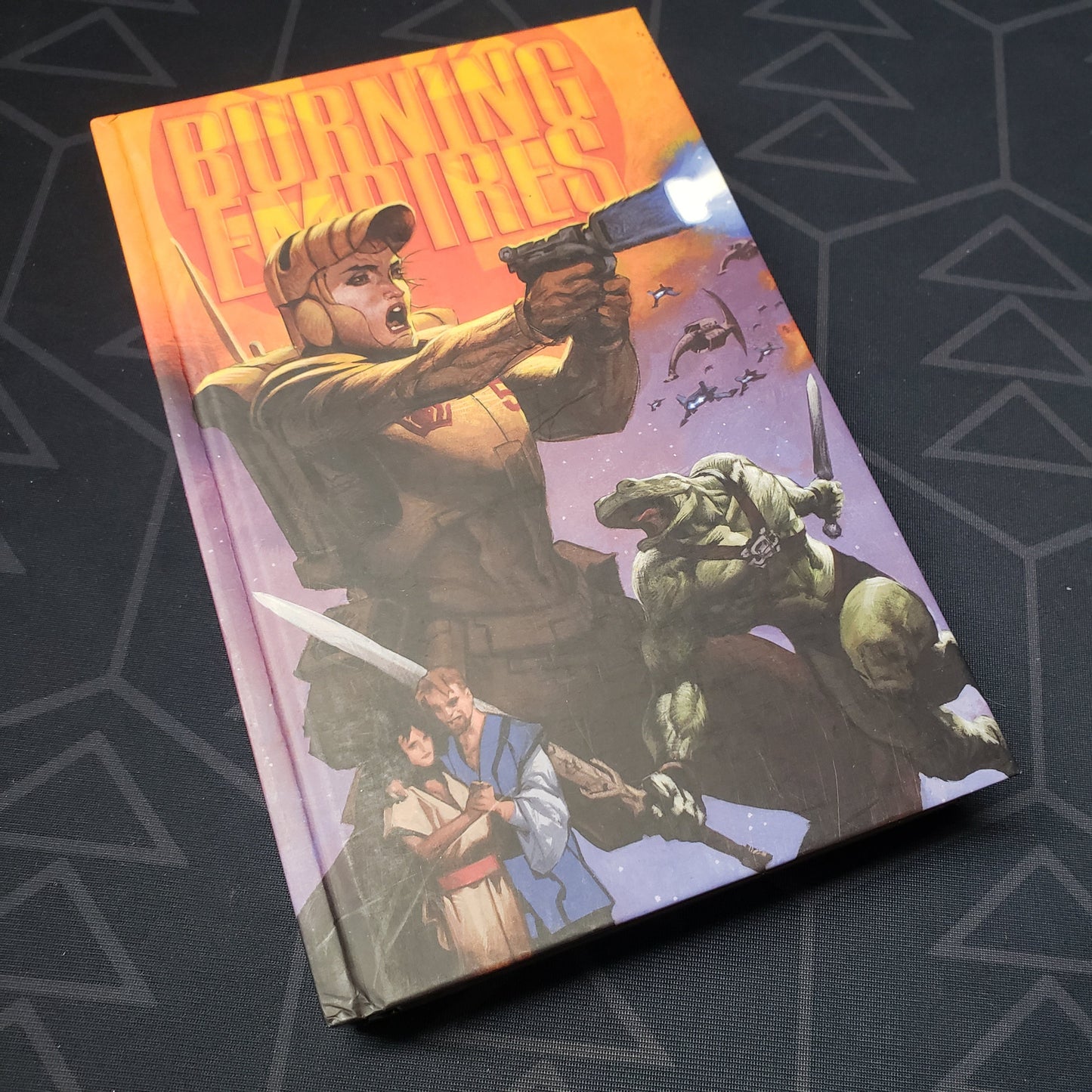 Image shows the front cover of the Burning Empires roleplaying game book