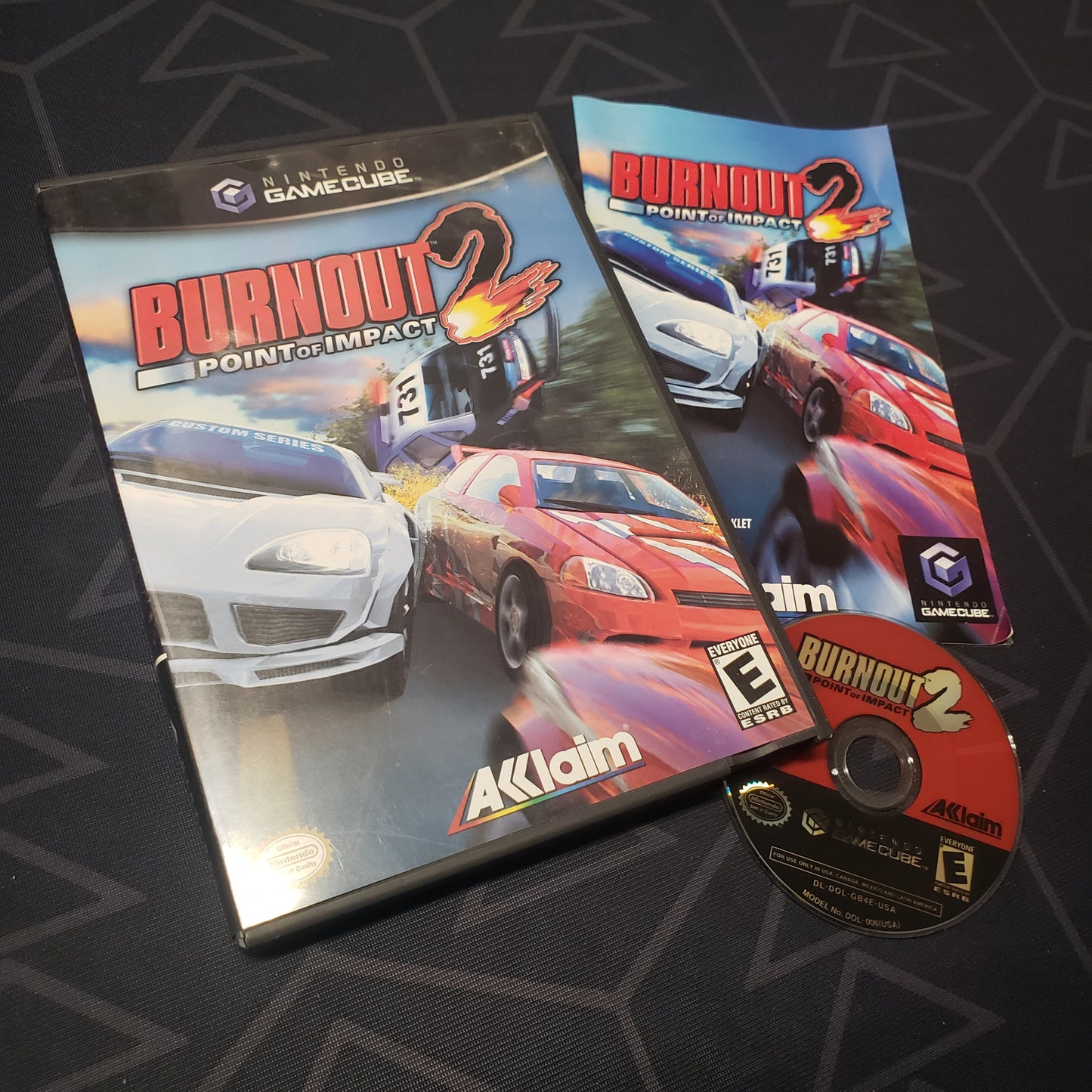 Image shows the case, manual and disc for the video game Burnout 2: Point of Impact for Nintendo GameCube