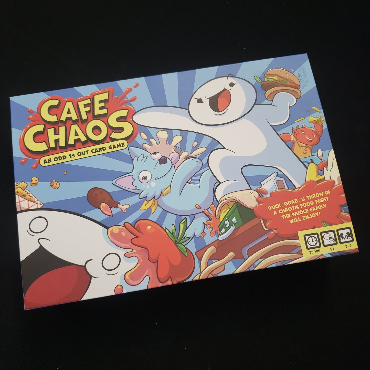 Image shows the front cover of the box of the Cafe Chaos board game
