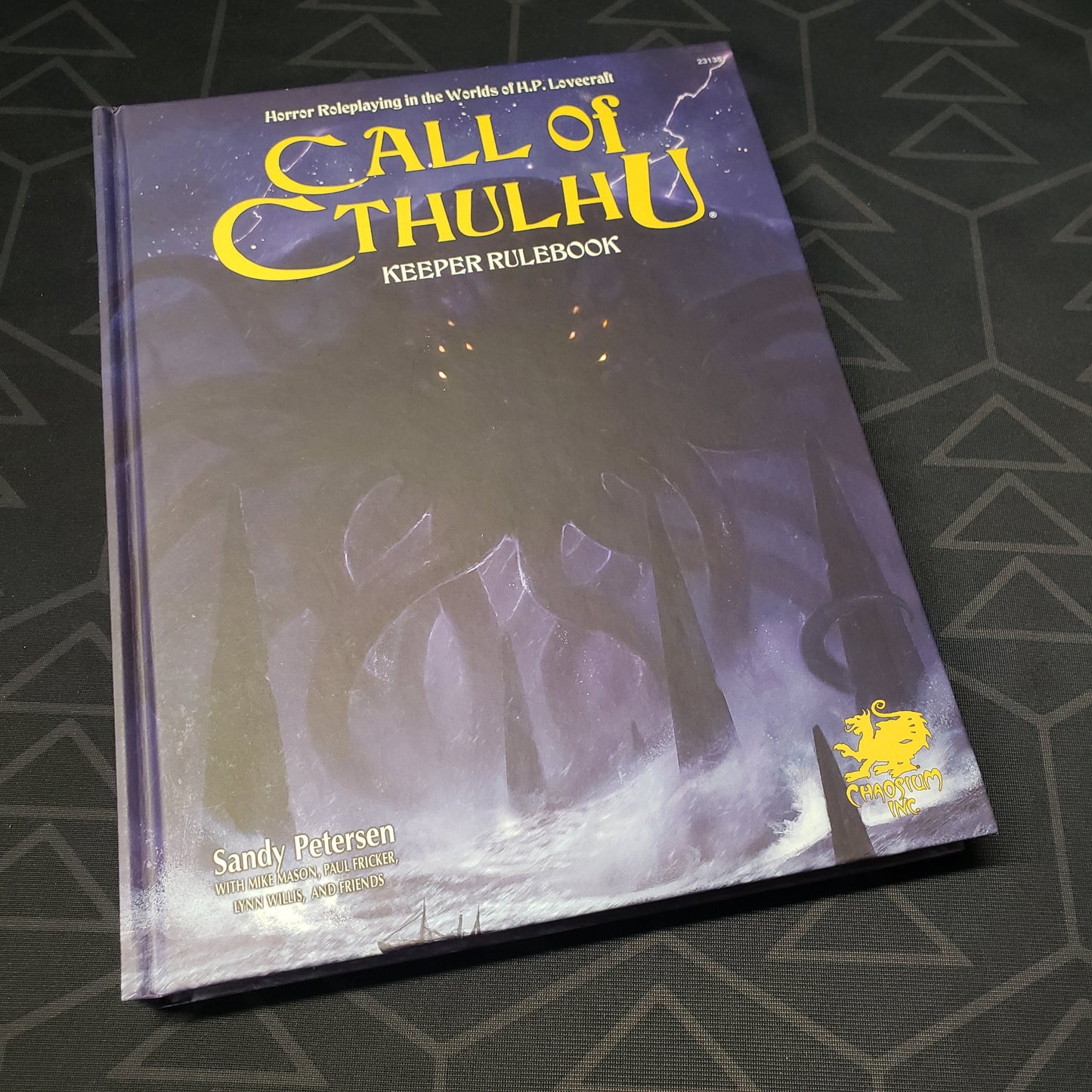 Image shows the front cover of the Keeper Rulebook for the roleplaying game Call of Cthulhu 7E