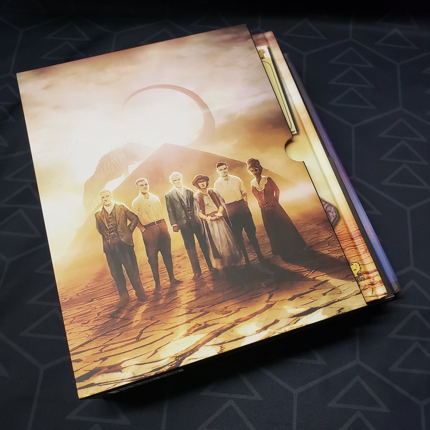 Image shows the front cover of the Masks of Nyarlathotep Slipcase Box Set for the roleplaying game Call of Cthulhu 7E