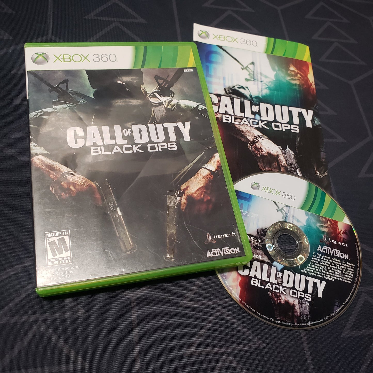 Image shows the case, manual and disc for the video game Call of Duty: Black Ops for Xbox 360