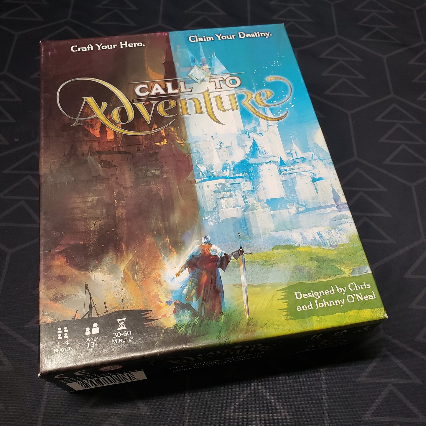 Image shows the front cover of the box of the Call to Adventure card game