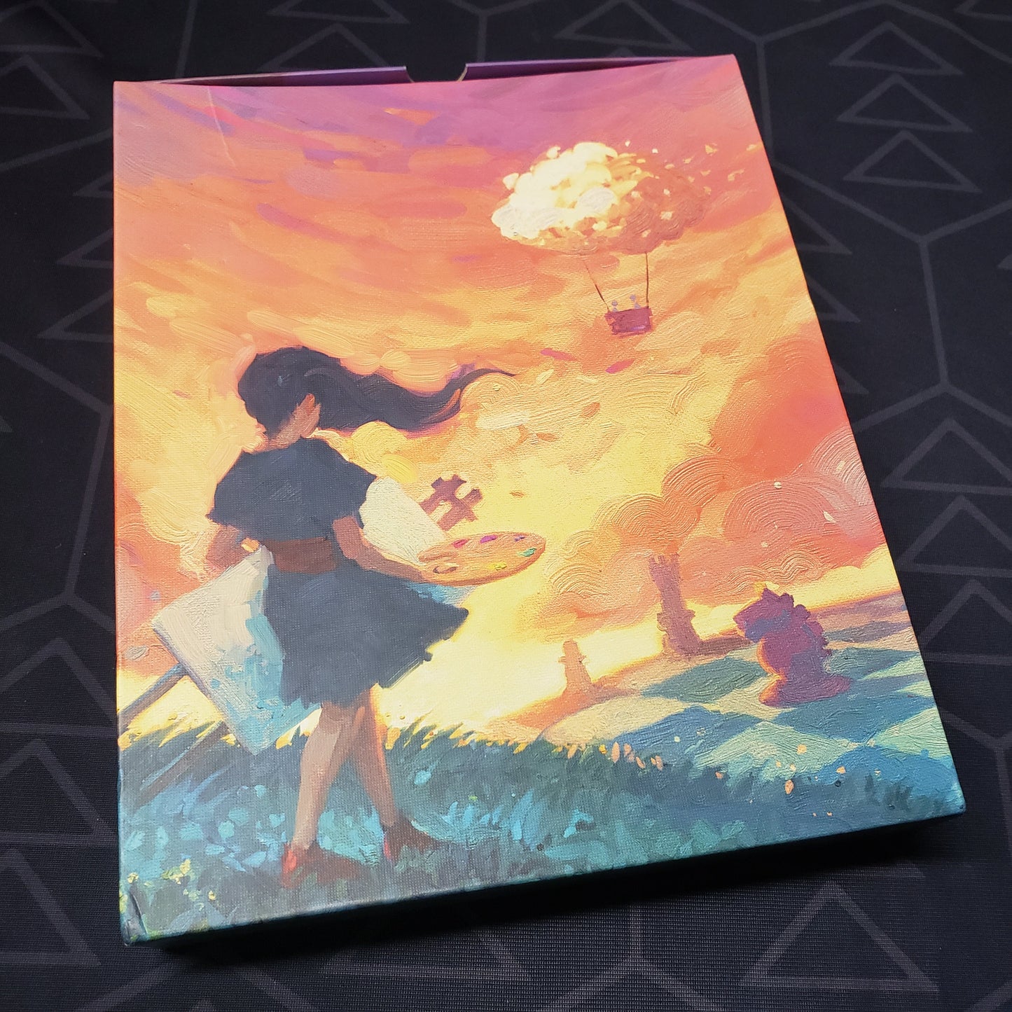 Image shows the front cover of the box of the Canvas board game