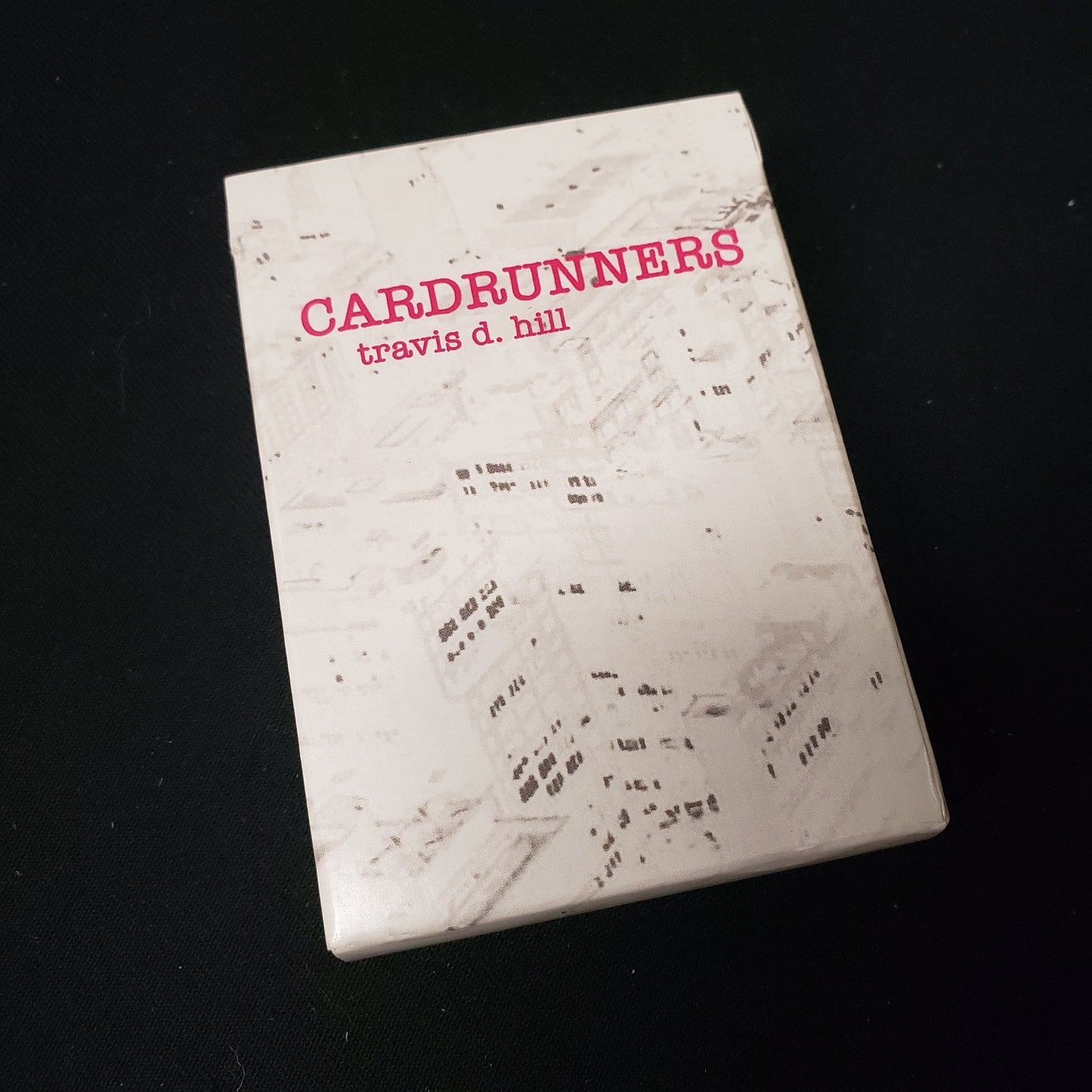 Image shows the front cover of the box of the CardRunners card game