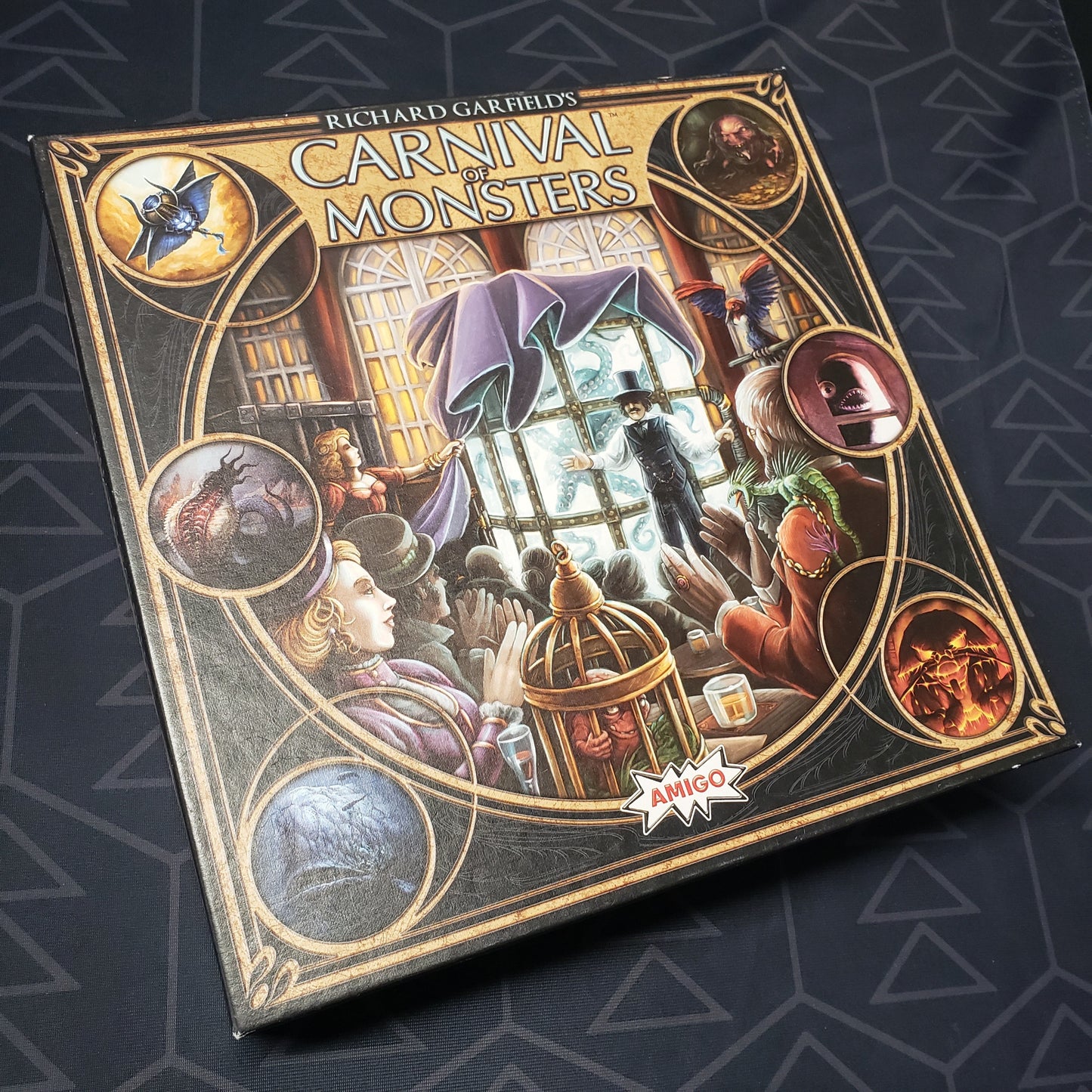 Image shows the front cover of the box of the Carnival of Monsters board game
