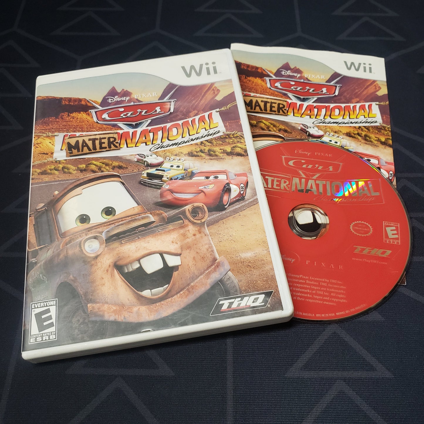 Image shows the case, manual & disc for the video game Cars: Mater-National Championship for Nintendo Wii