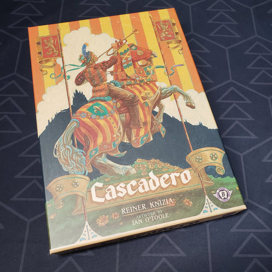Image shows the front cover of the box of the Cascadero board game