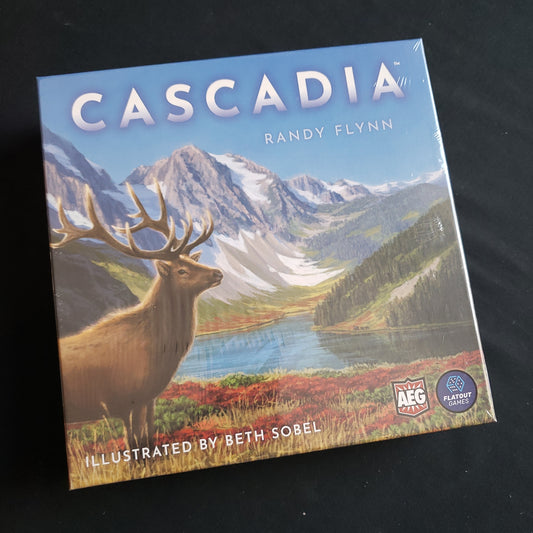 Image shows the front cover of the box of the Cascadia board game