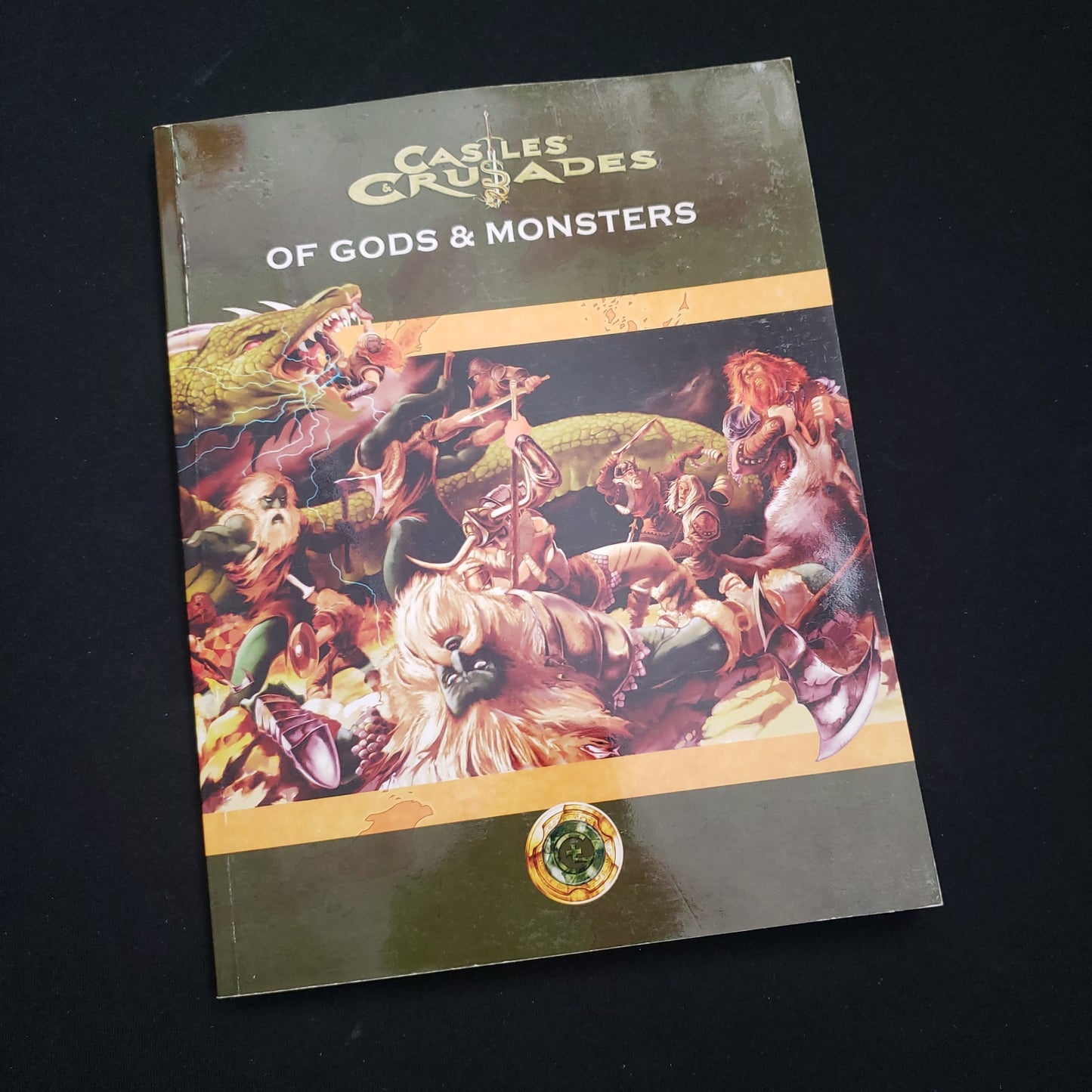 Image shows the front cover of the book Of Gods & Monsters for the Castles & Crusades roleplaying game