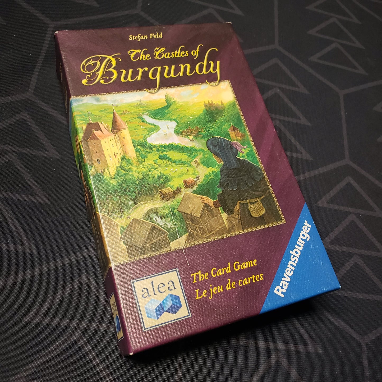 Image shows the front cover of the box for The Castles of Burgundy: The Card Game