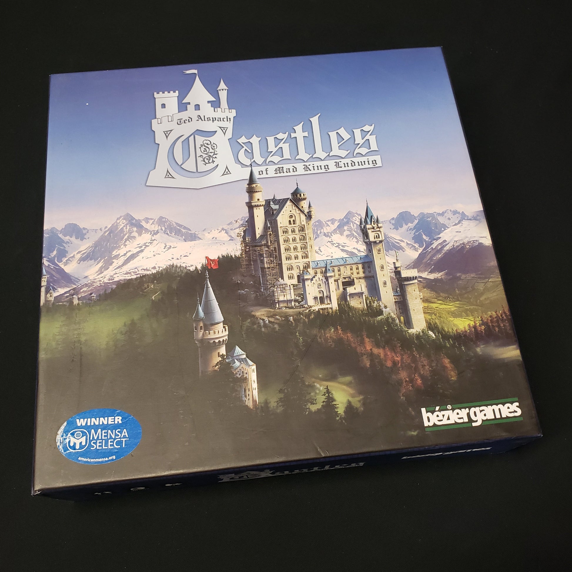 Image shows the front cover of the box of the Castles of Mad King Ludwig board game