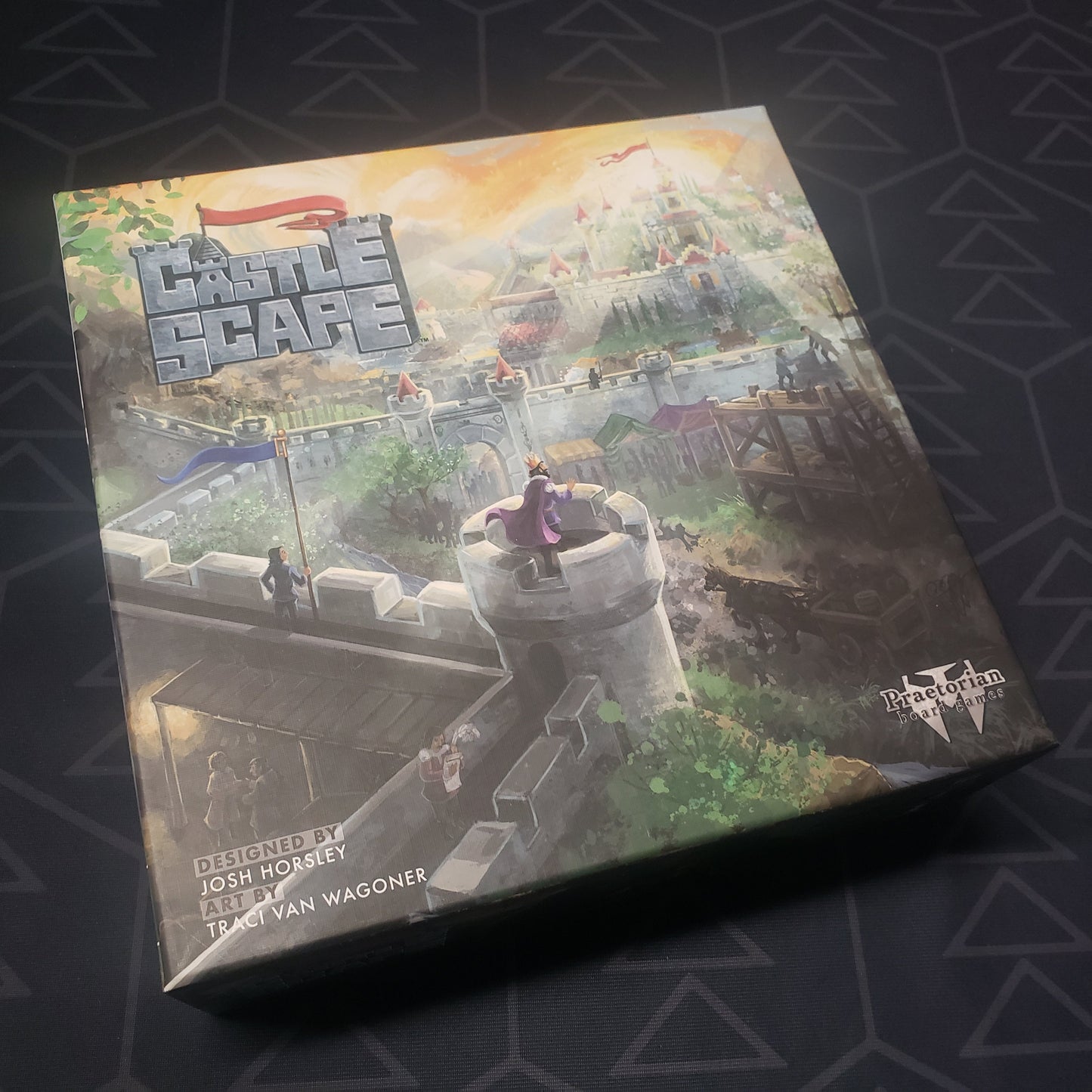 Image shows the front cover of the box for the CastleScape board game