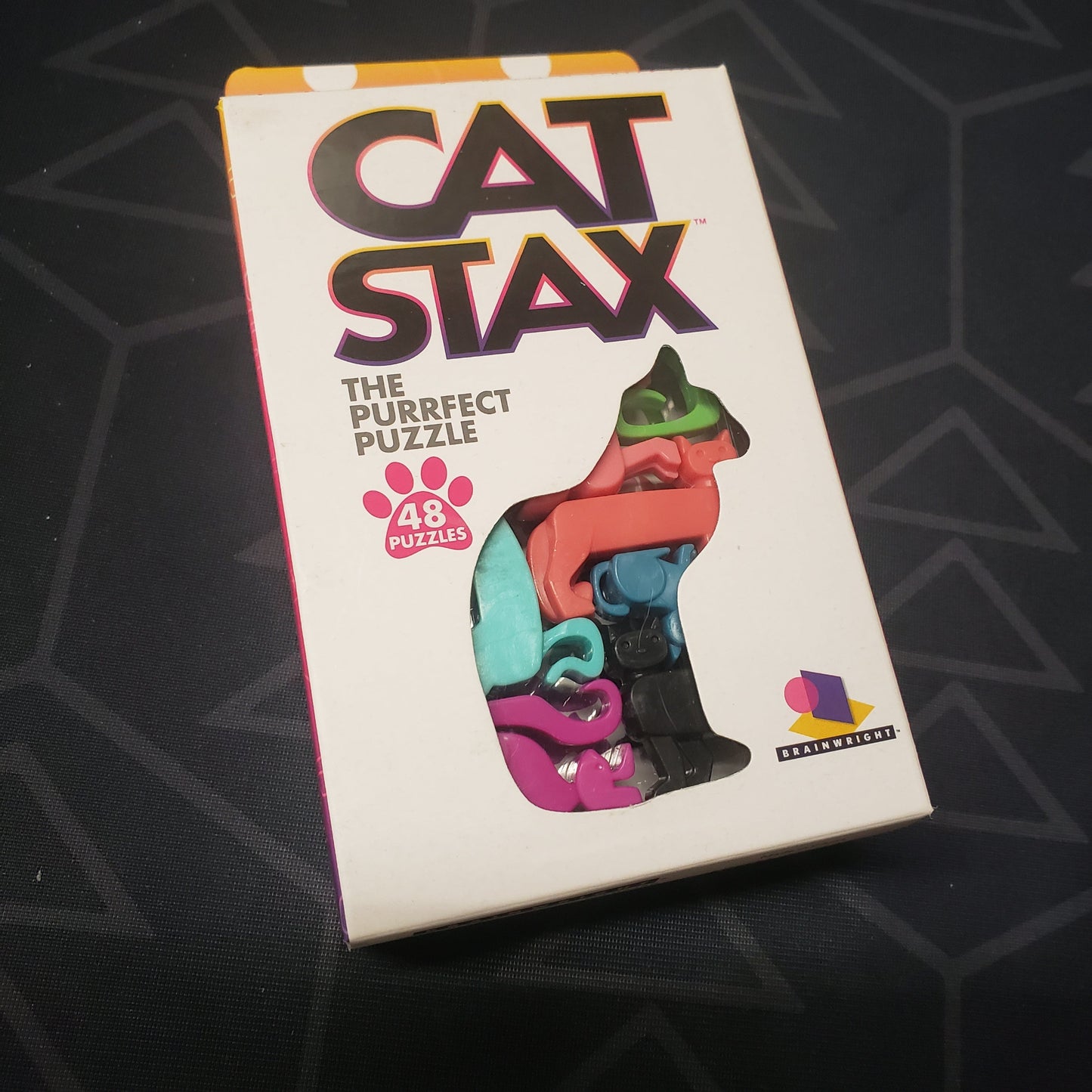 Image shows the front cover of the box for the Cat Stax puzzle game