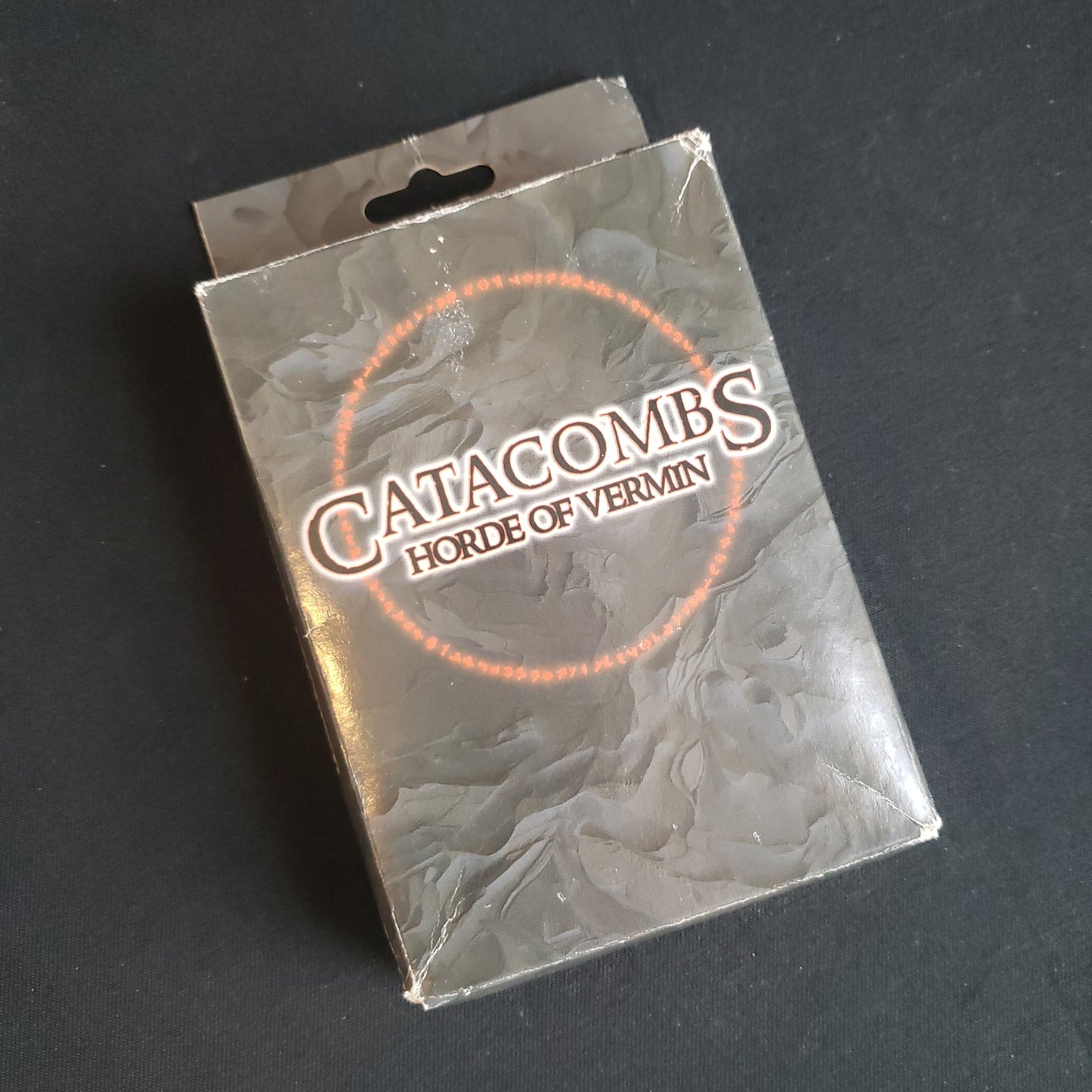 Image shows the front of the box for the Horde of Vermin expansion for the Catacombs board game