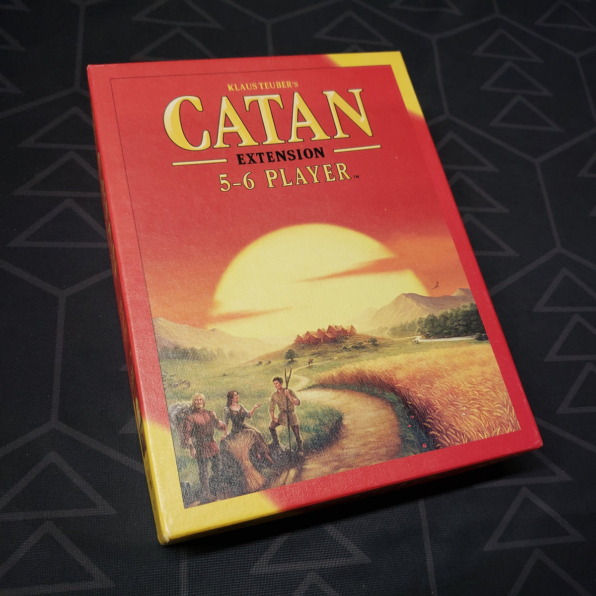 Image shows the front cover of the box of the 5-6 Player Extension for the board game Catan