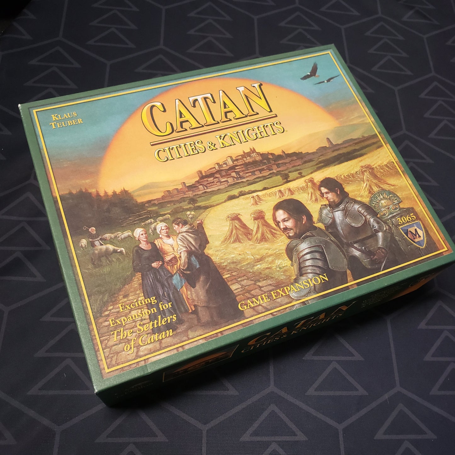 Image shows the front cover of the box of the Cities & Knights expansion for the Catan board game