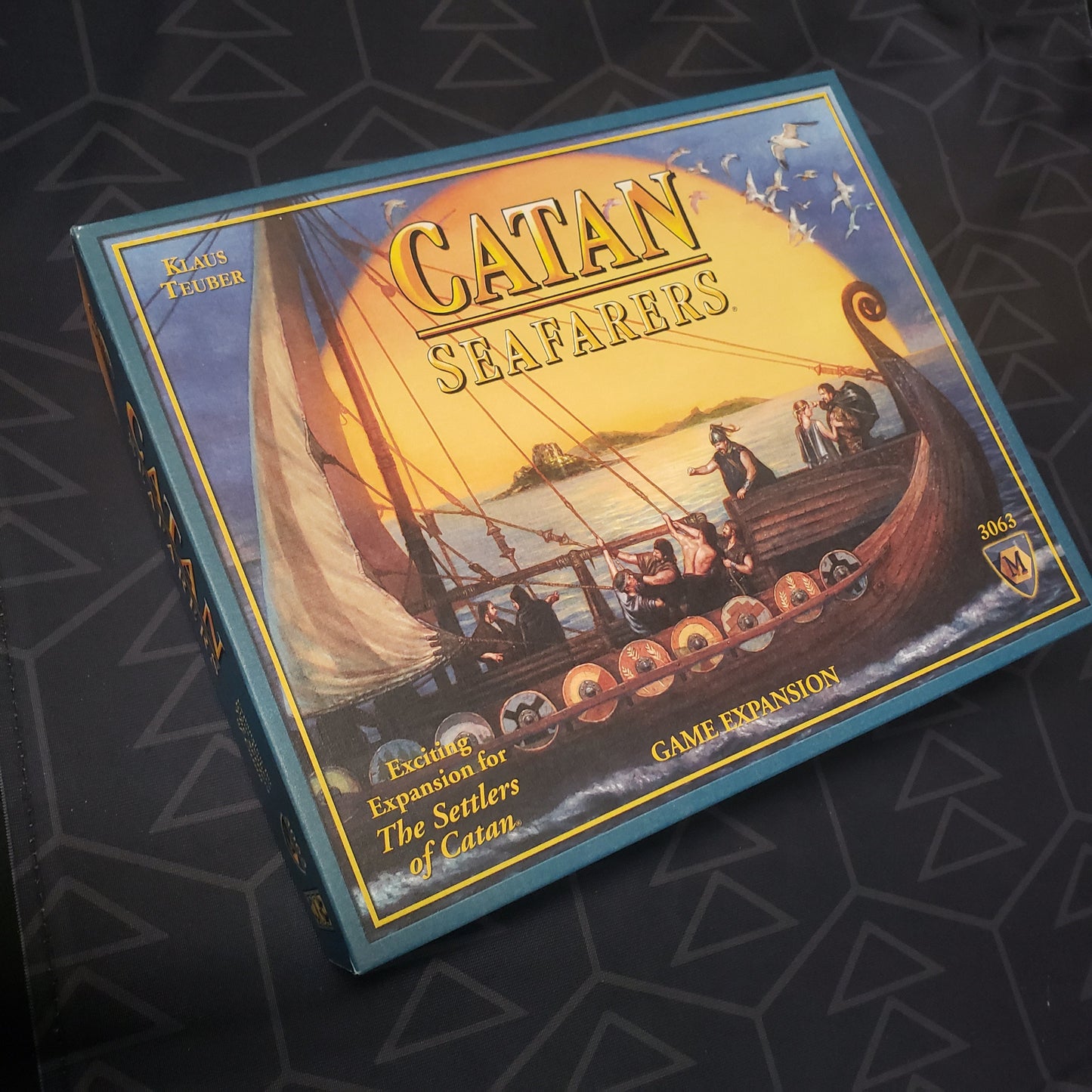 Image shows the front cover of the box of the Seafarers expansion for the board game Catan