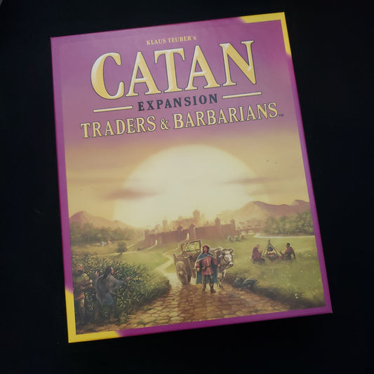 Image shows the front of the box for the Traders & Barbarians expansion for the Catan board game