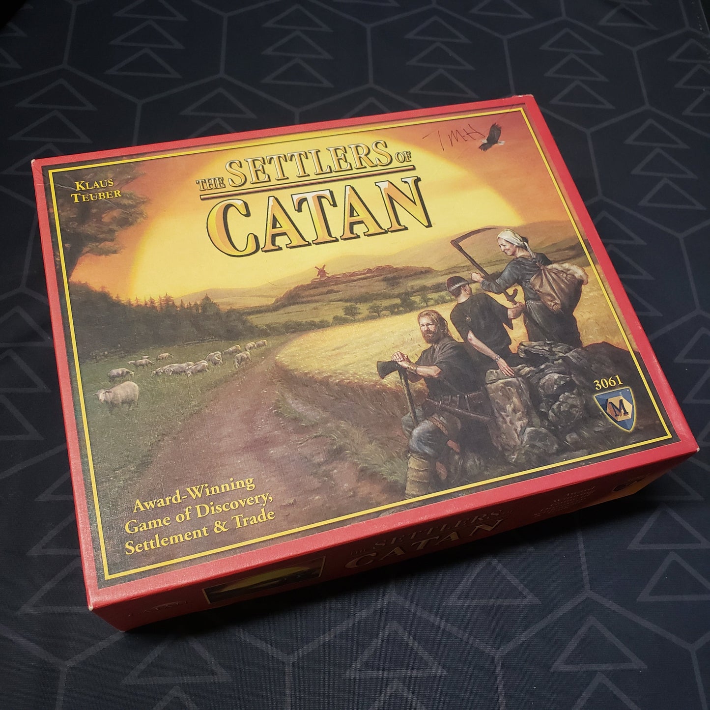 Image shows the front cover of the box of the Catan board game