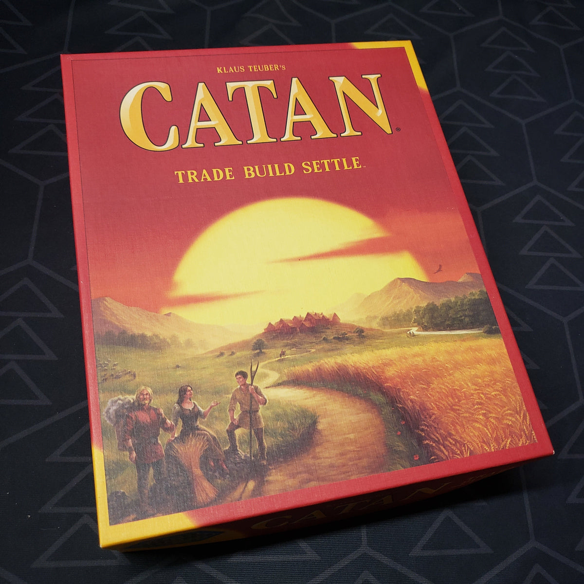 Image shows the front cover of the box of the Catan board game