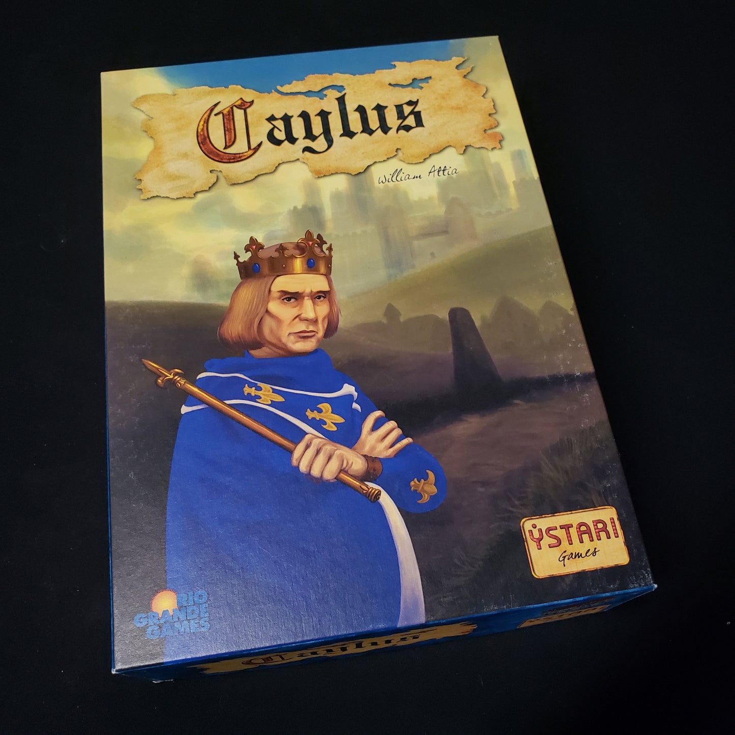 Image shows the front cover of the box of the Caylus board game