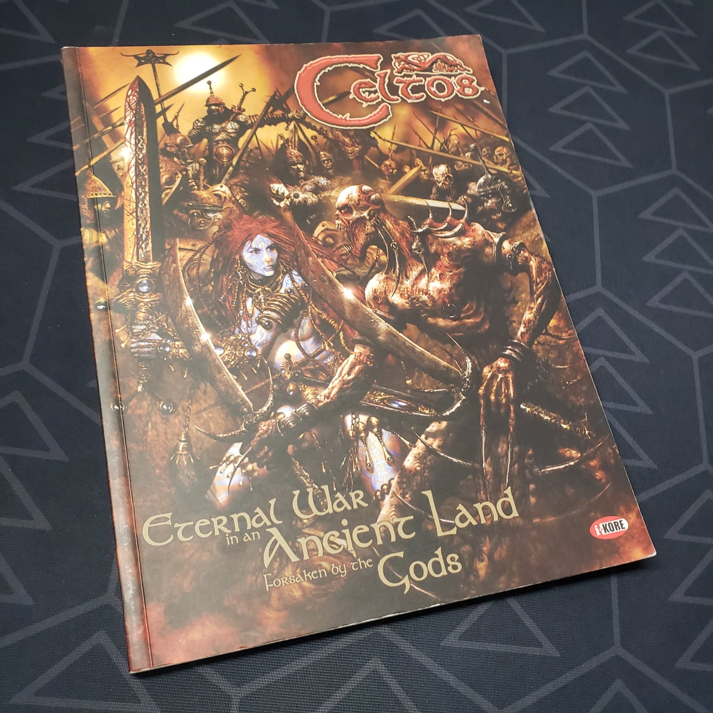 Image shows the front cover of the Celtos: Eternal War in an Ancient Land Forsaken by the Gods wargaming book