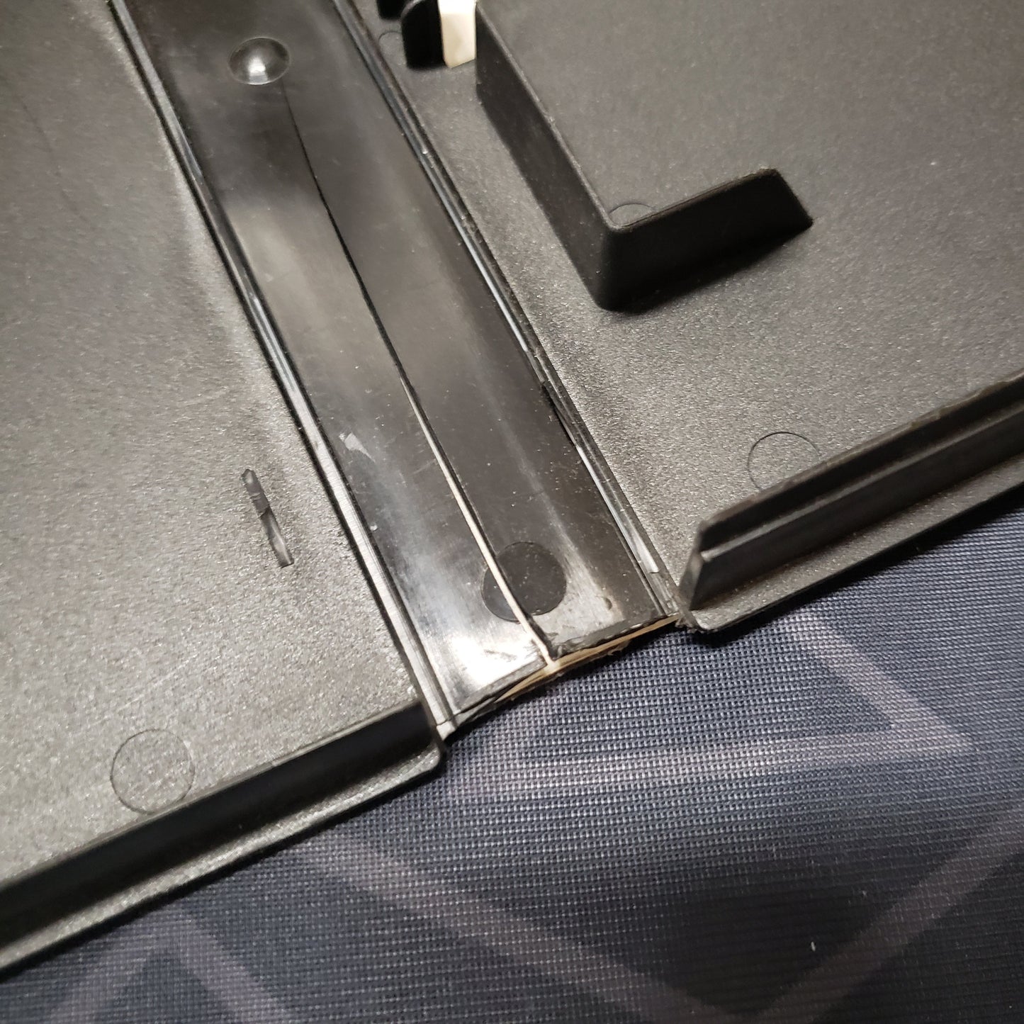 Image shows a crack on the inside of the case for the video game Centurion: Defender of Rome for Sega Genesis